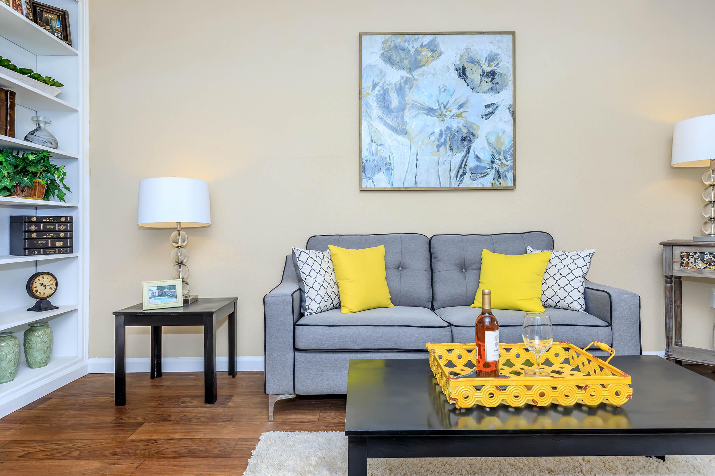 a living room filled with furniture and a fireplace