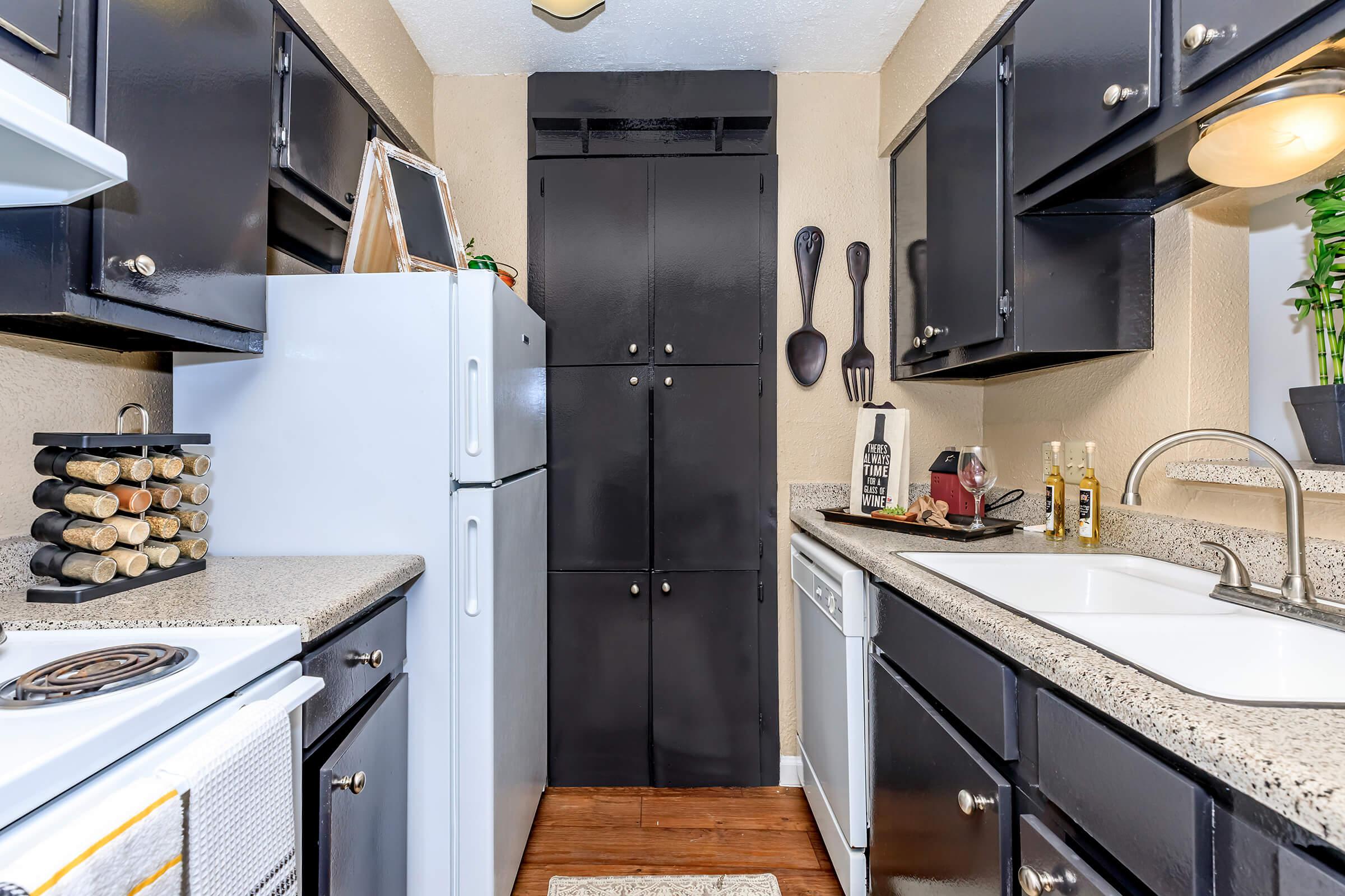 a kitchen with a stove and a sink