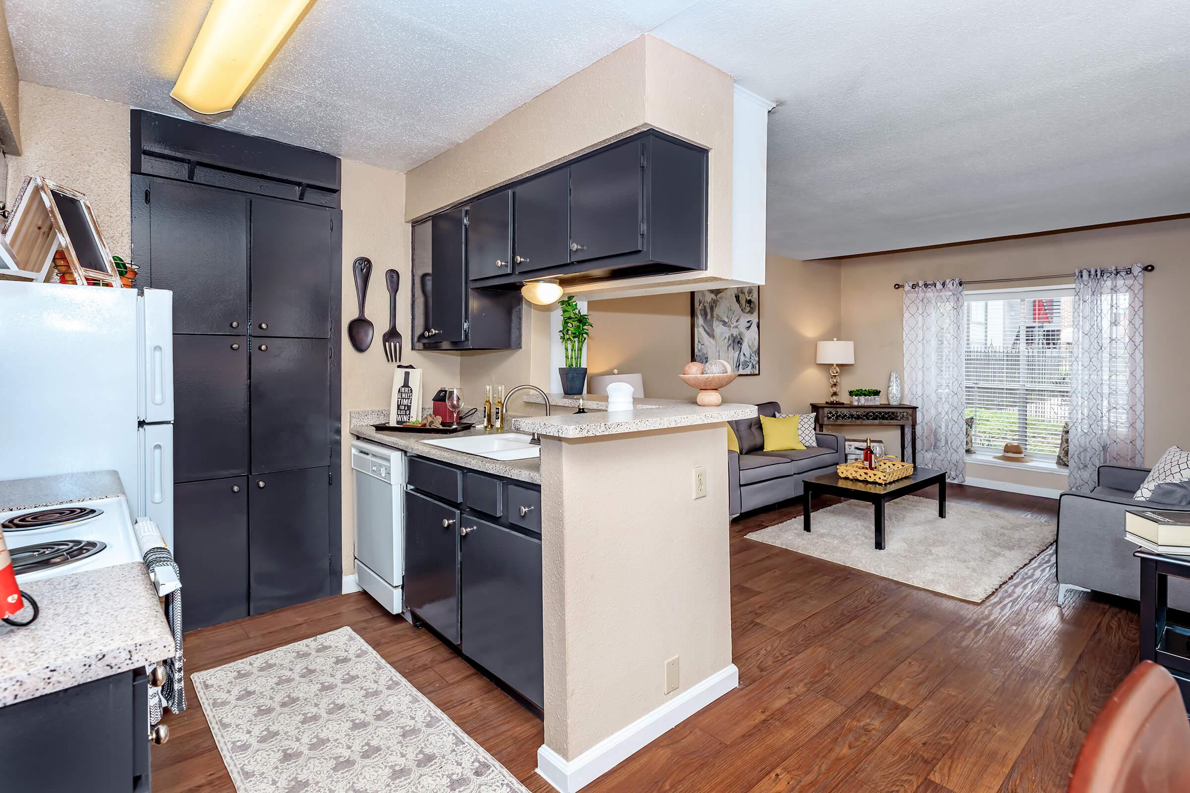 a kitchen with an island in the middle of a room