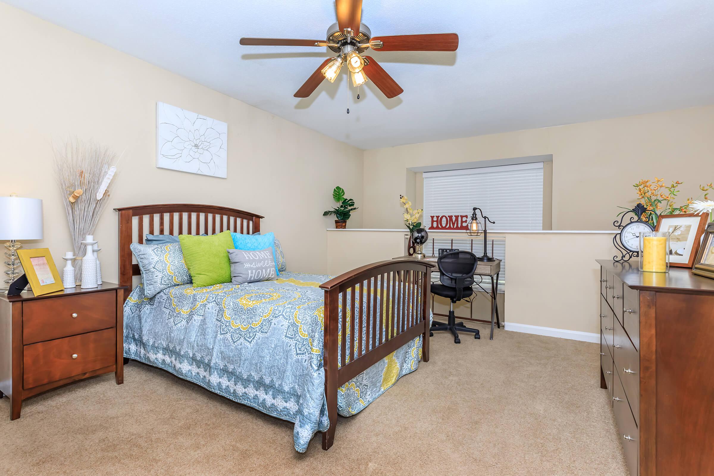 a living room filled with furniture and a tv