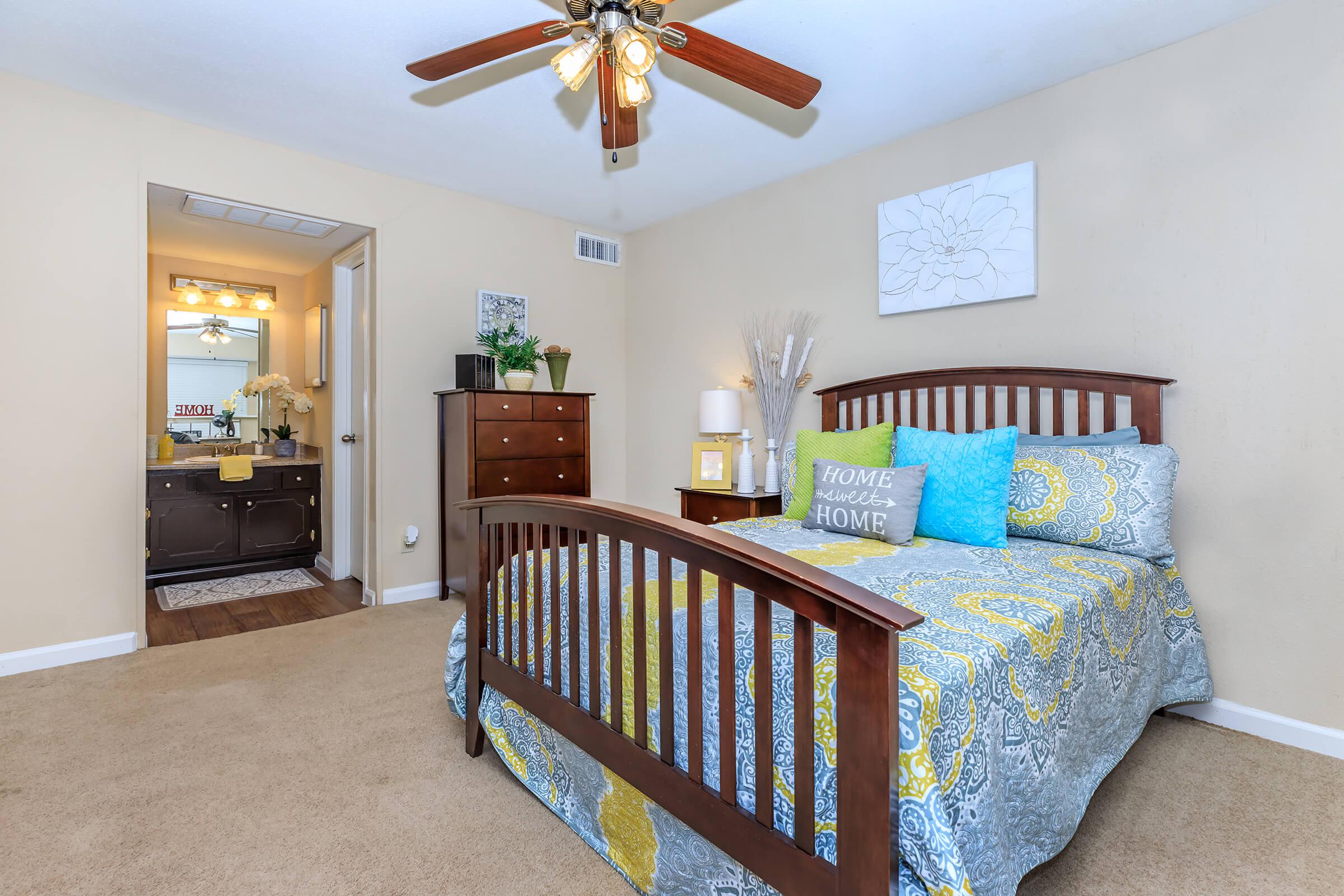 a living room filled with furniture and a bed