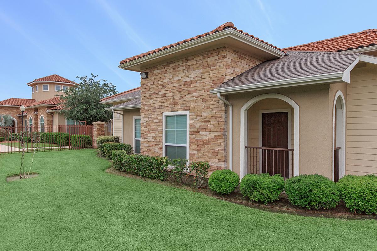 a large lawn in front of a house