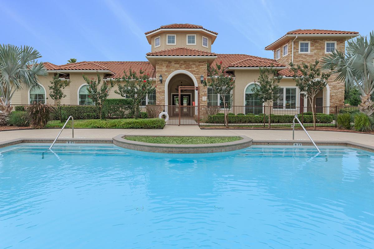 a large pool of water in front of a building