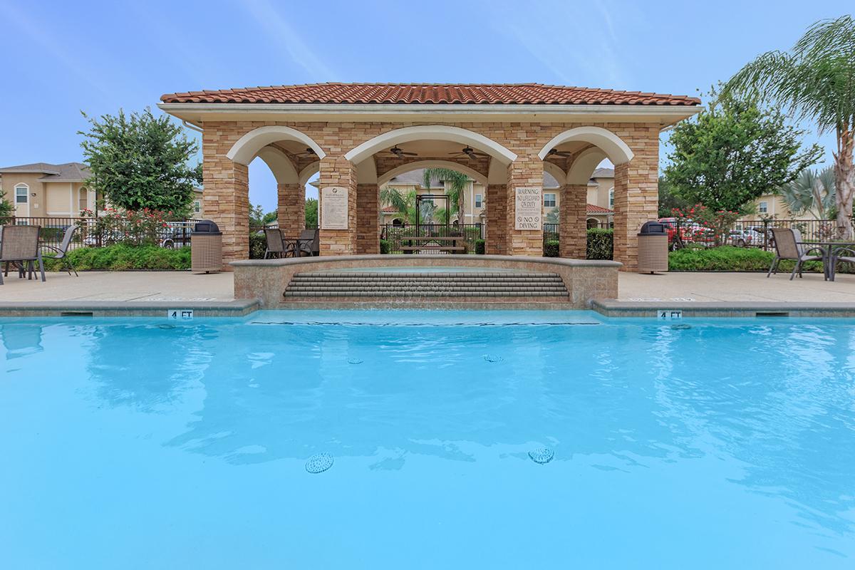 a large pool of water in front of a building