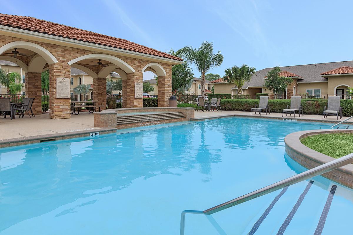 a large pool of water in front of a building