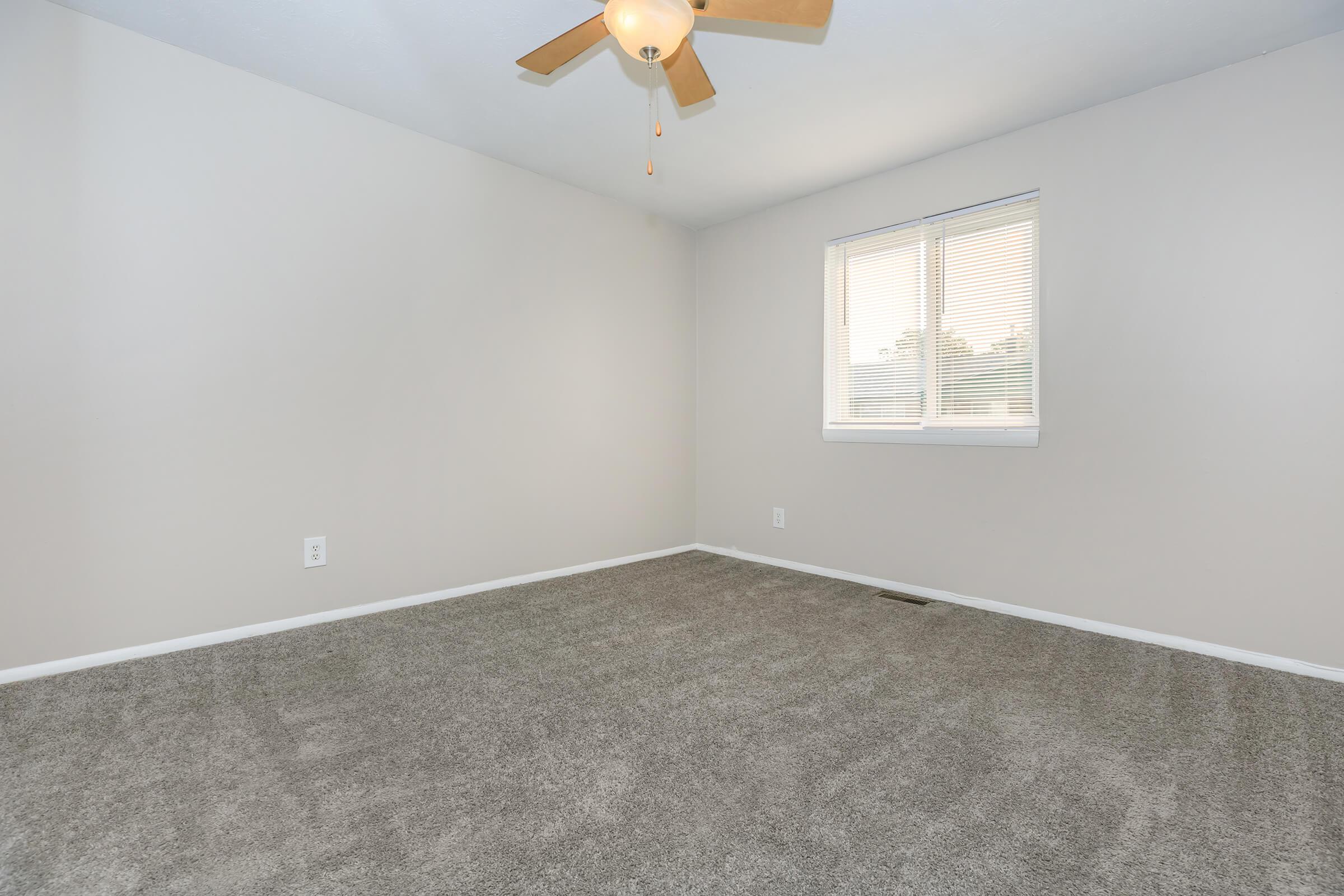 a bedroom with a large mirror