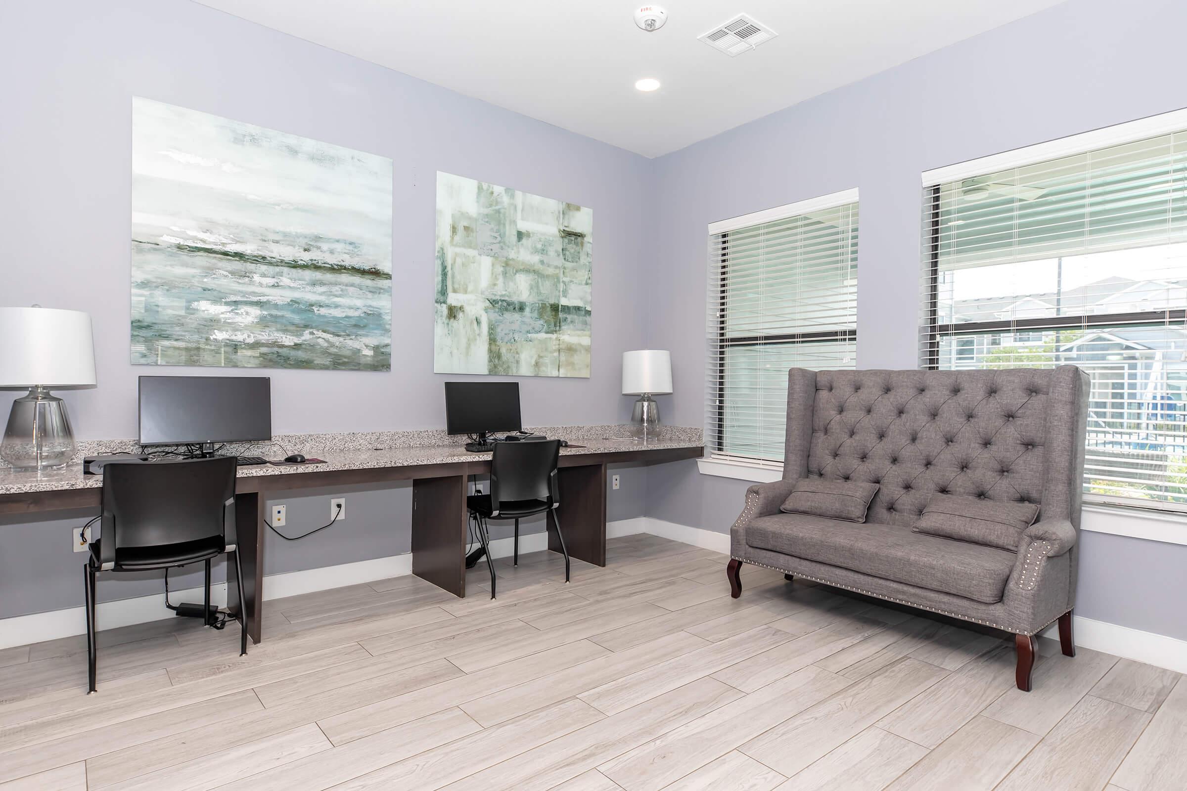 a living room filled with furniture and a large window