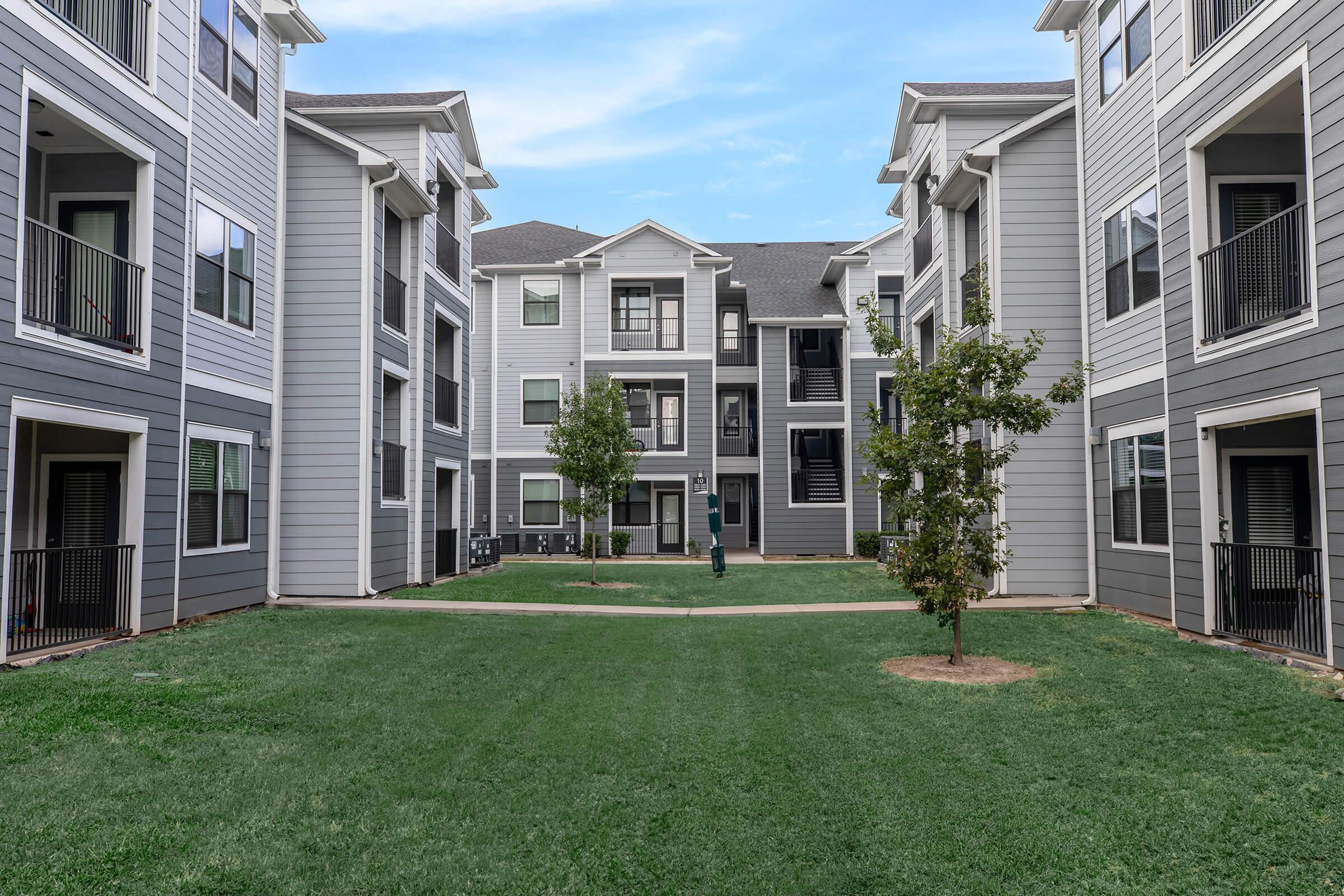 a large lawn in front of a house