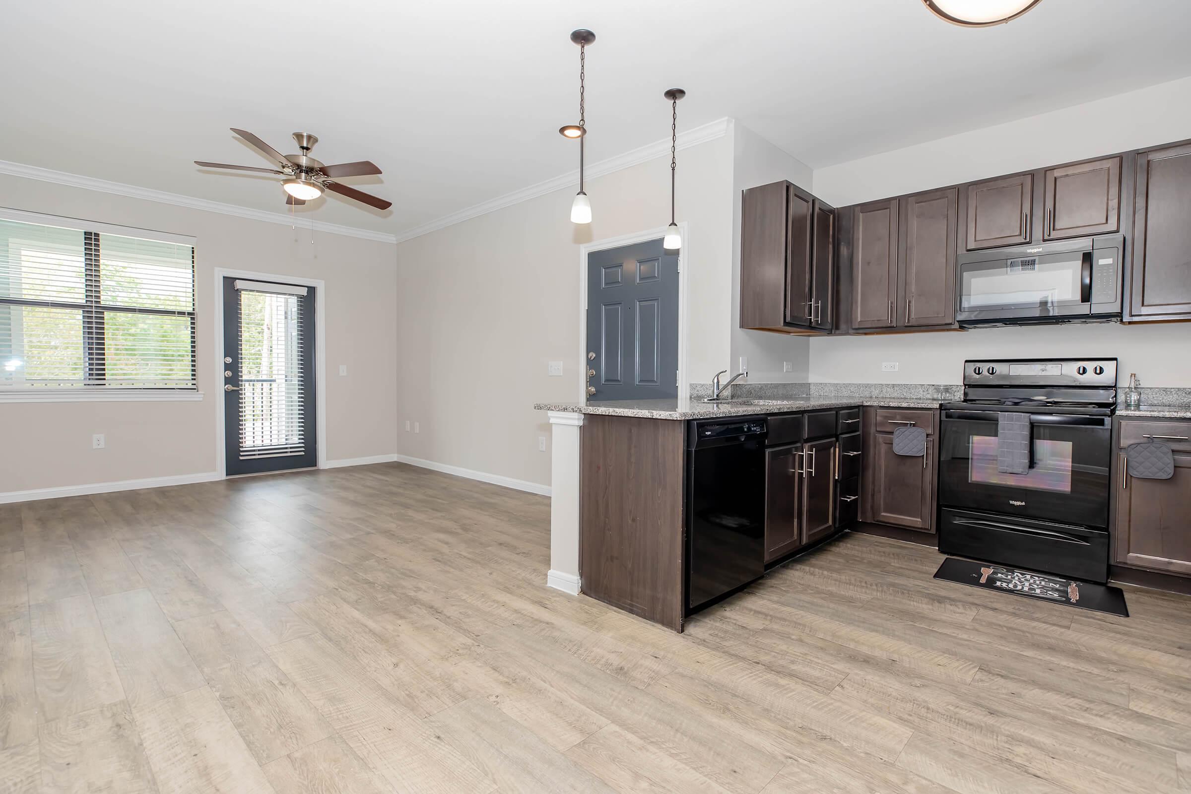 a large kitchen with stainless steel appliances