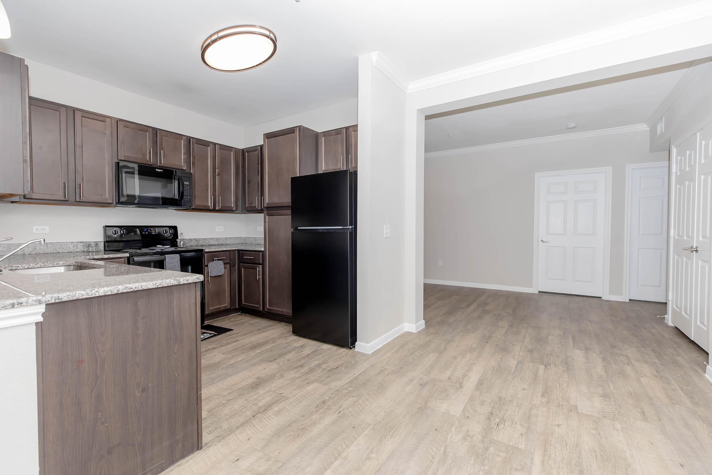 a kitchen with a building in the background