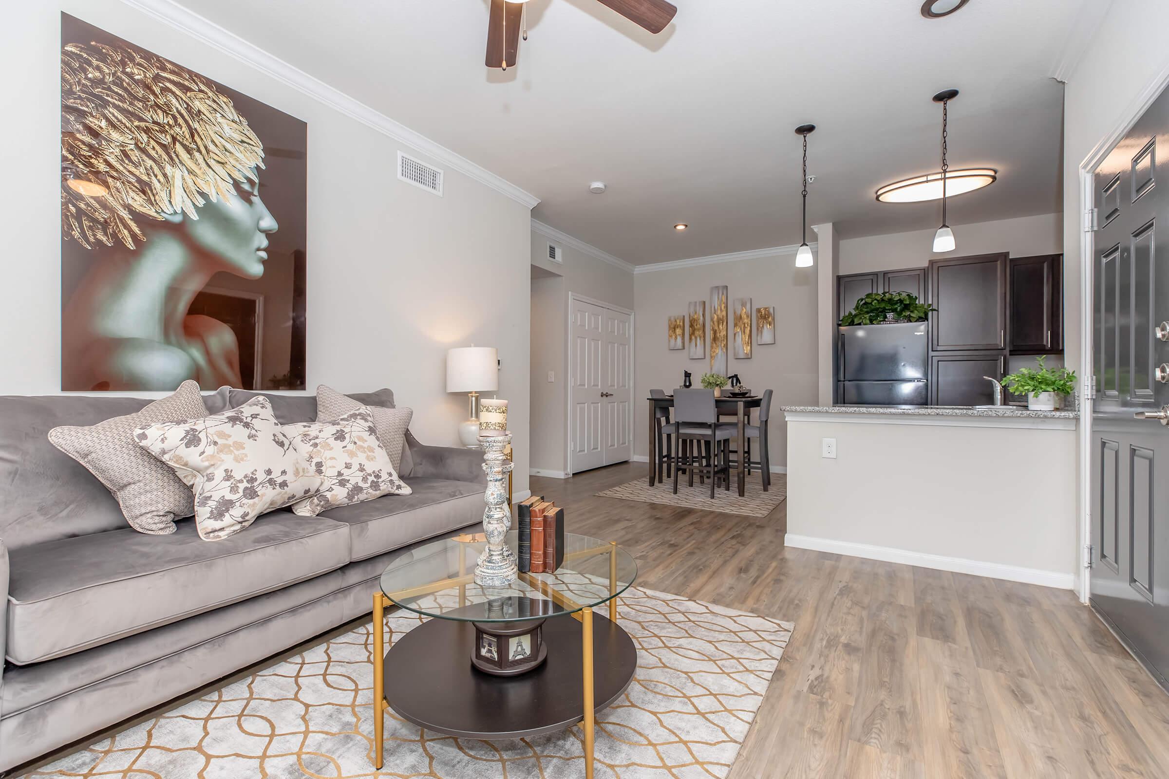 a living room filled with furniture and a fireplace