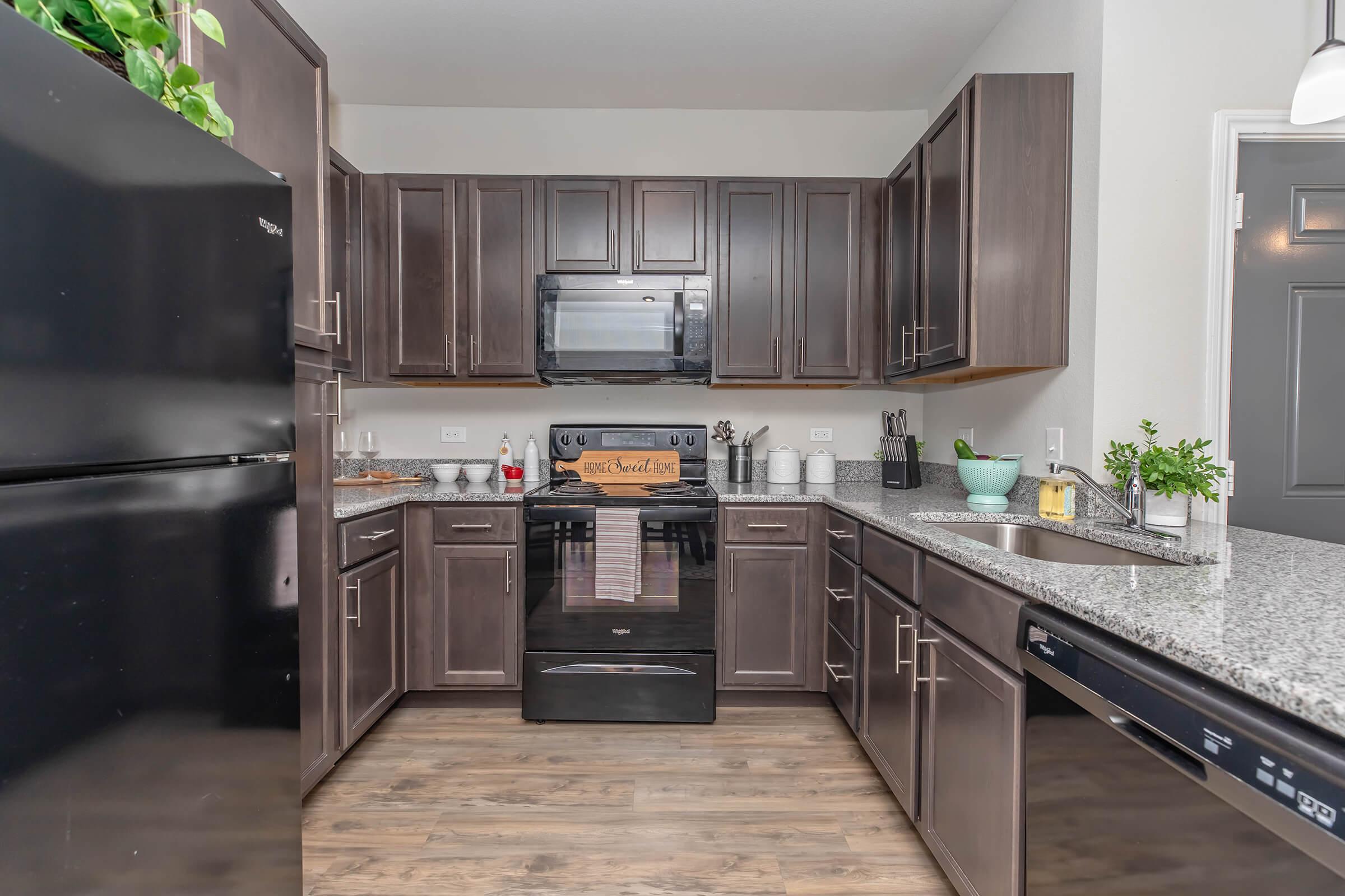 a large kitchen with stainless steel appliances