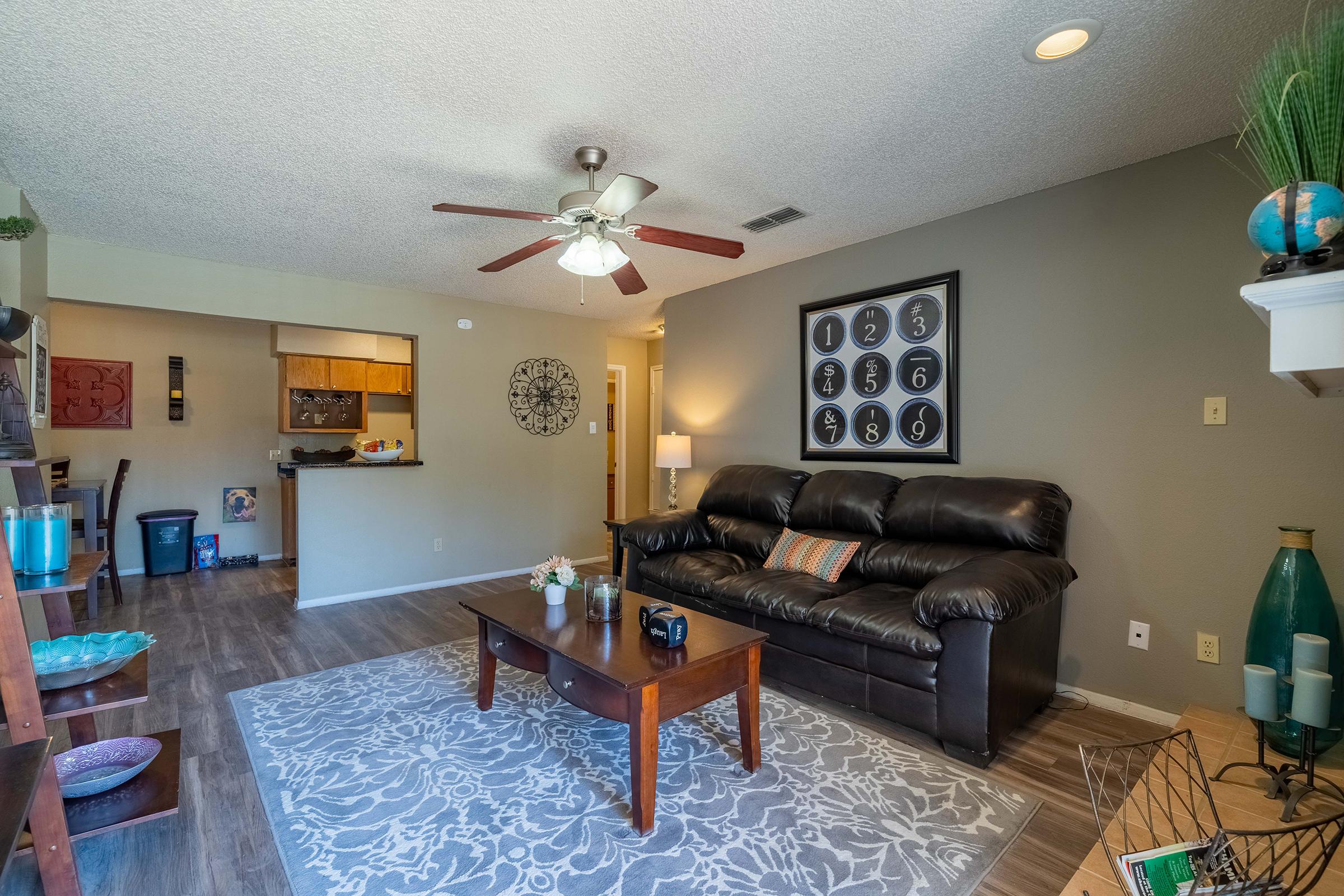 a living room filled with furniture and a table