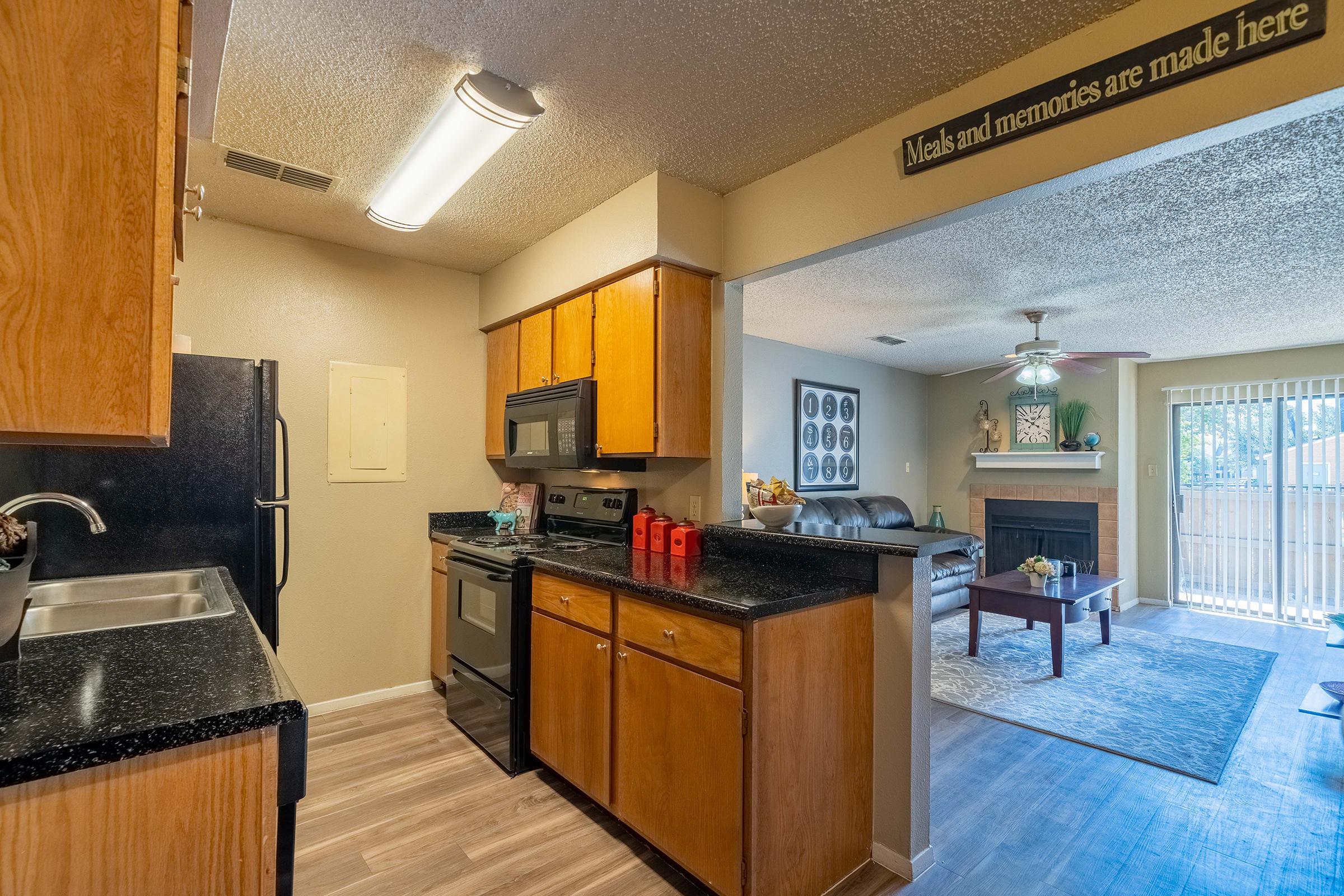 a kitchen filled with lots of furniture