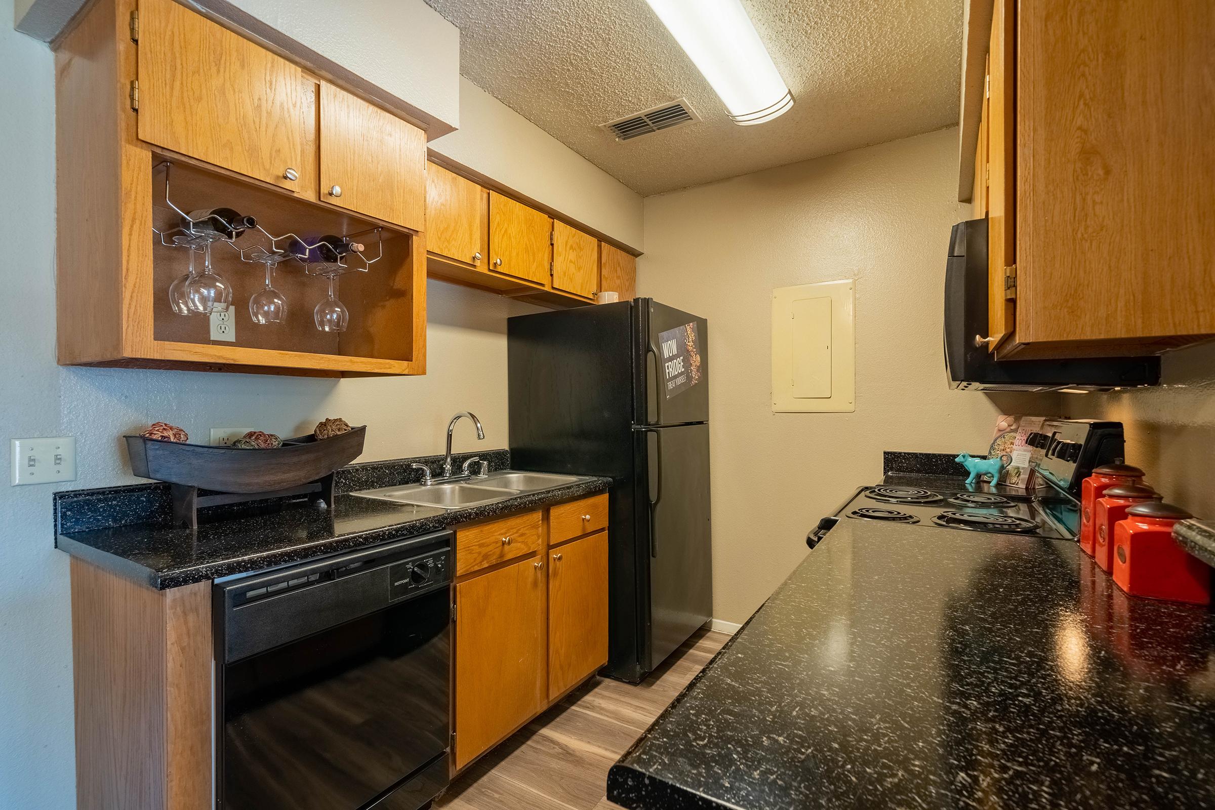 a kitchen with stainless steel appliances and wooden cabinets