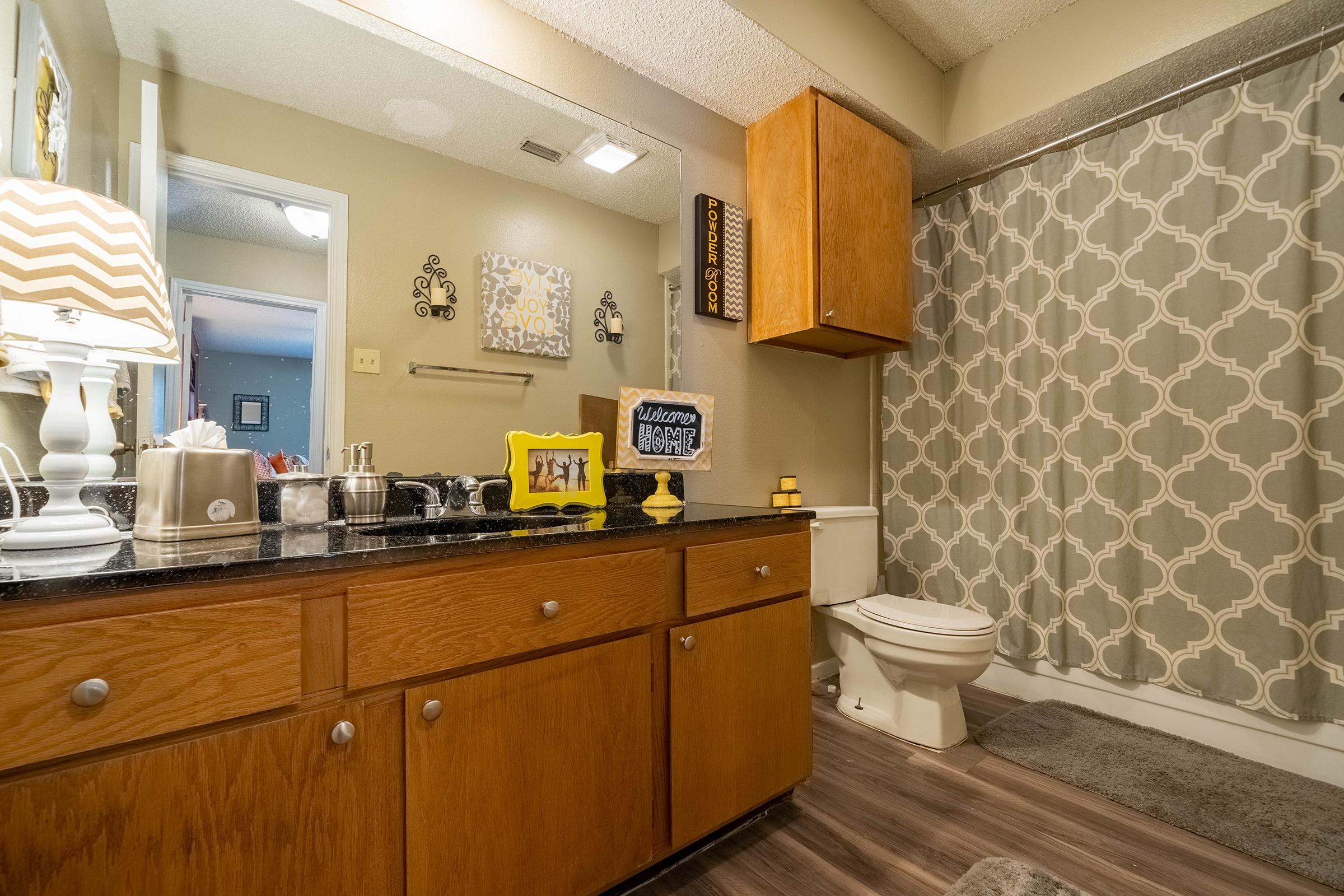 a kitchen with a sink and a mirror