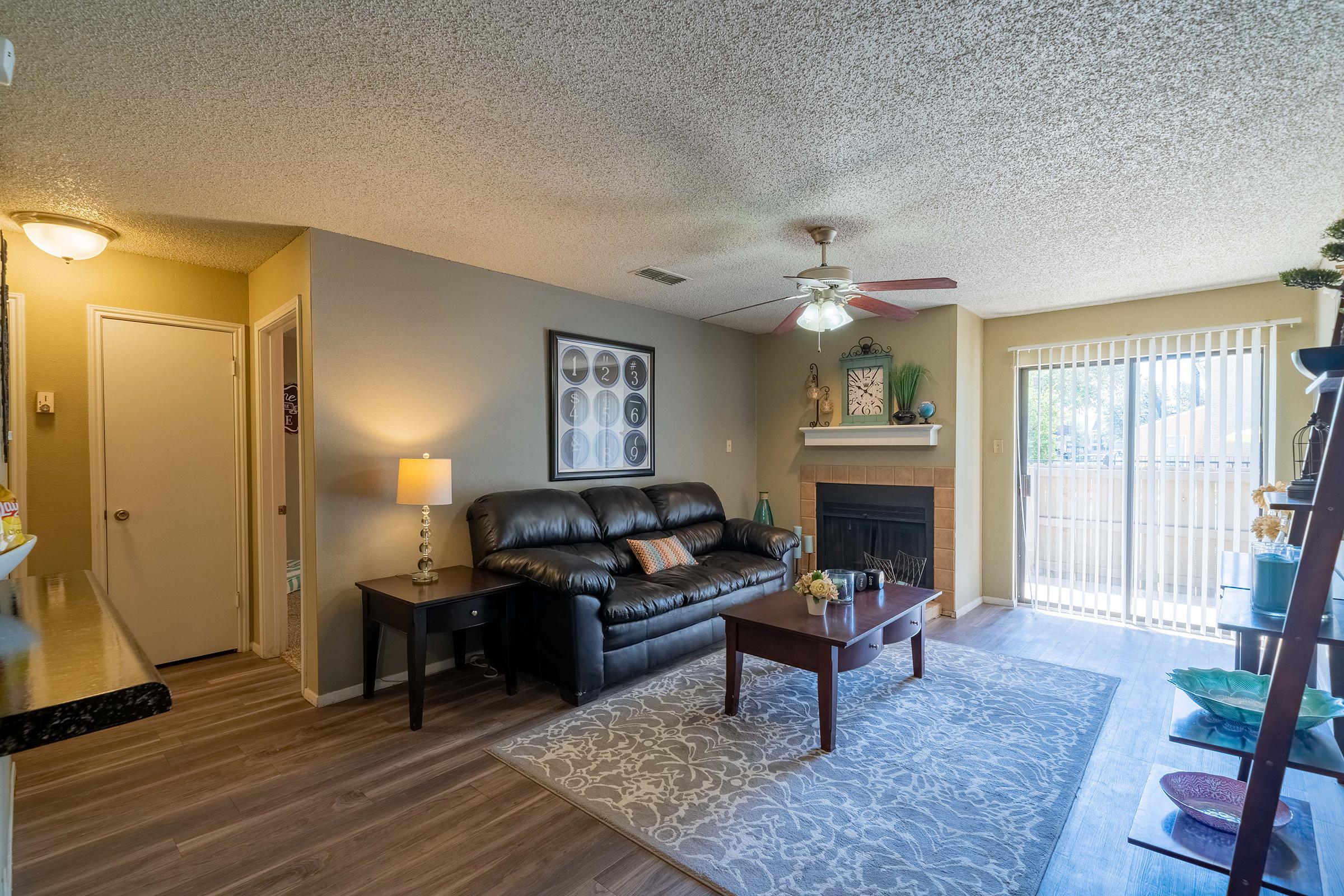 a living room filled with furniture and a table