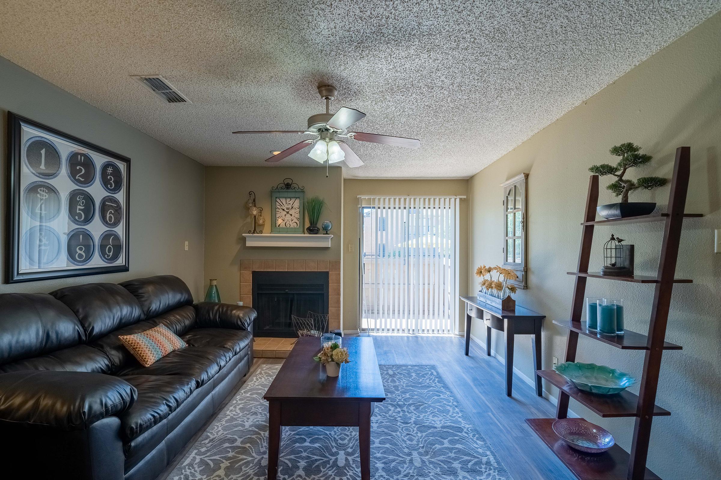 a living room filled with furniture and a fire place