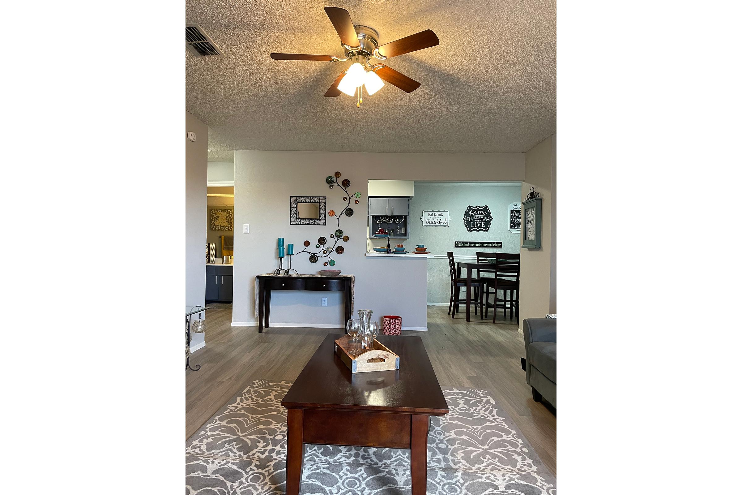 a living area with a table in a room