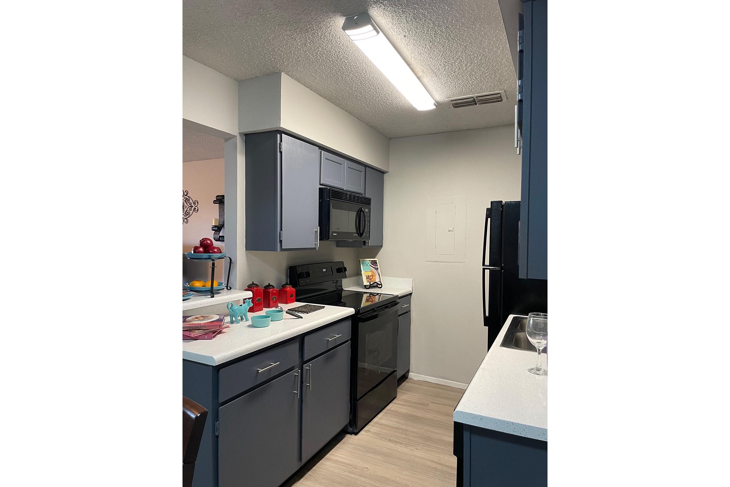 a kitchen with a stove and a refrigerator