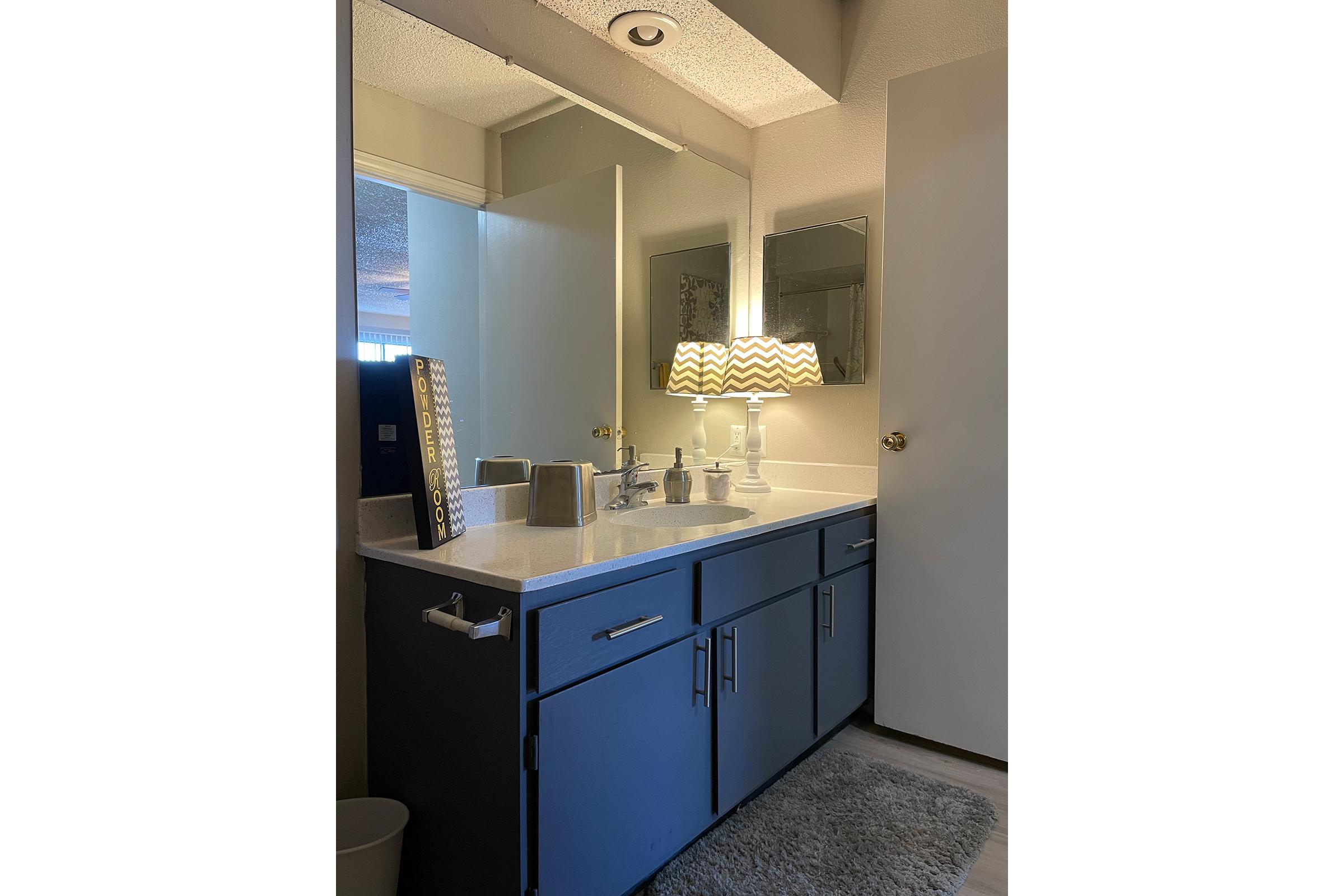 a kitchen with a sink and a refrigerator