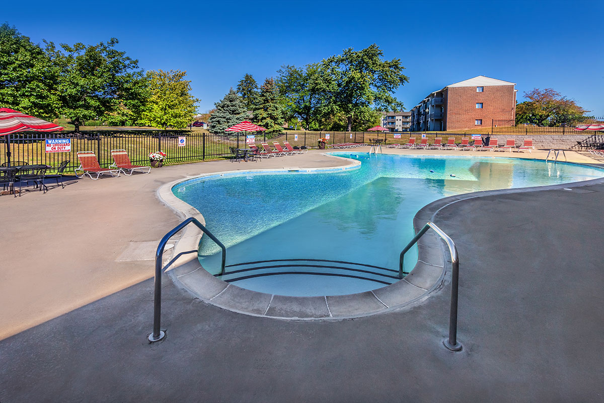 a chair sitting in front of a pool