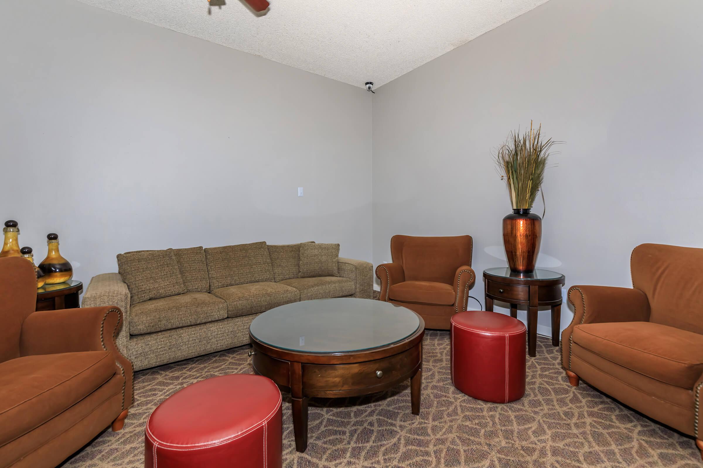 a living room filled with furniture and a flat screen tv