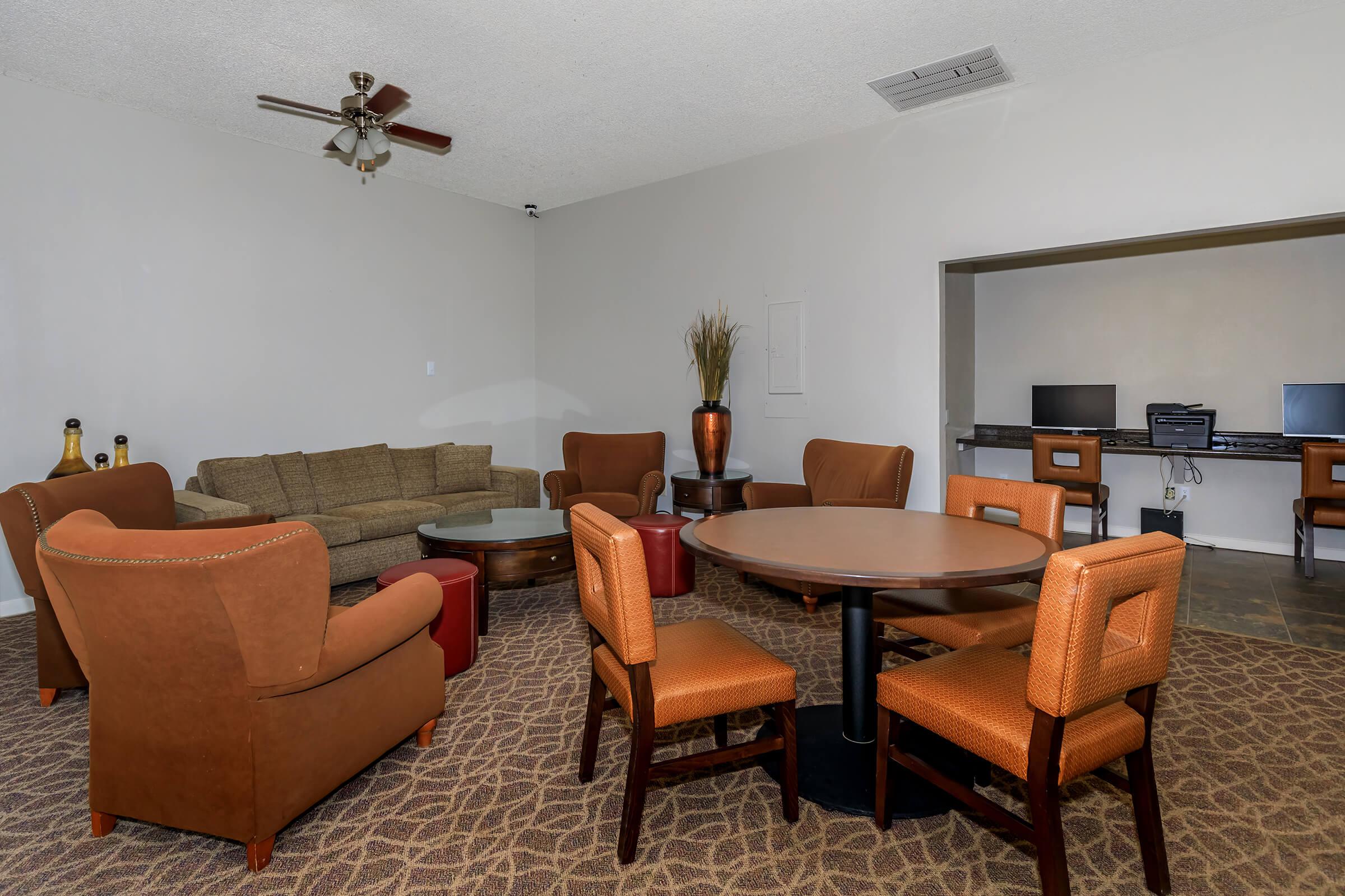 a living room filled with furniture and a table