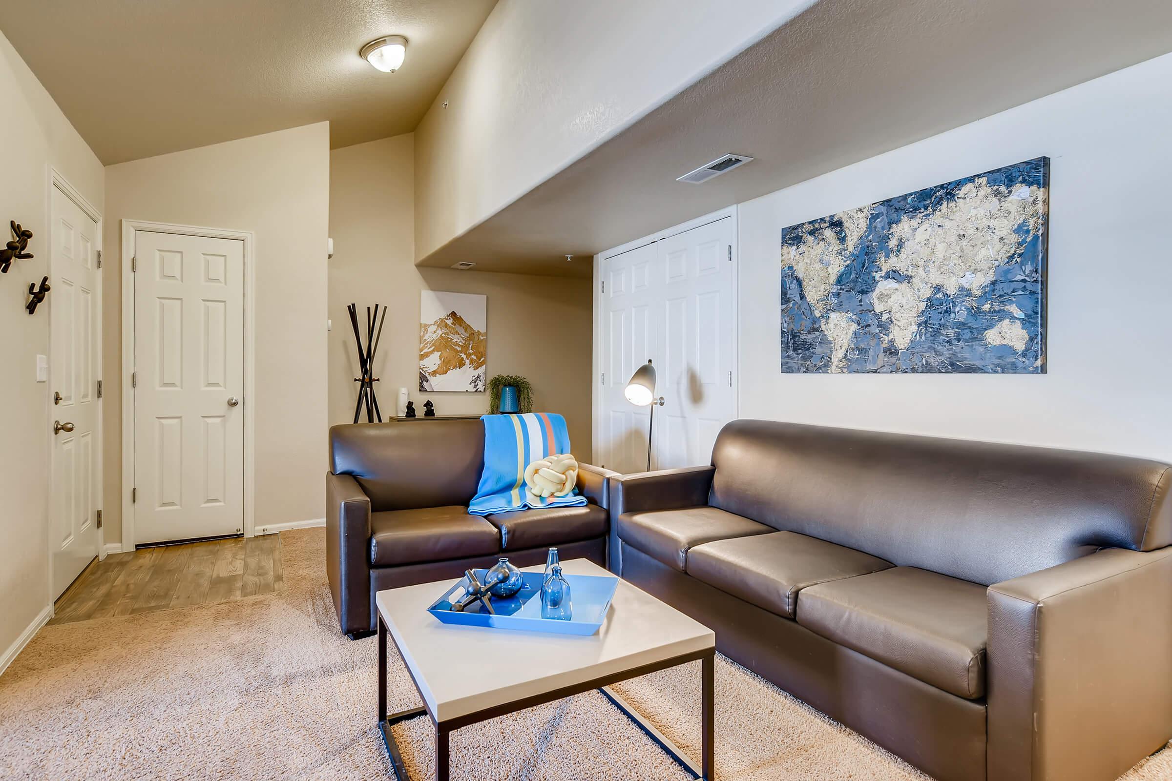 a living room filled with furniture and a tv