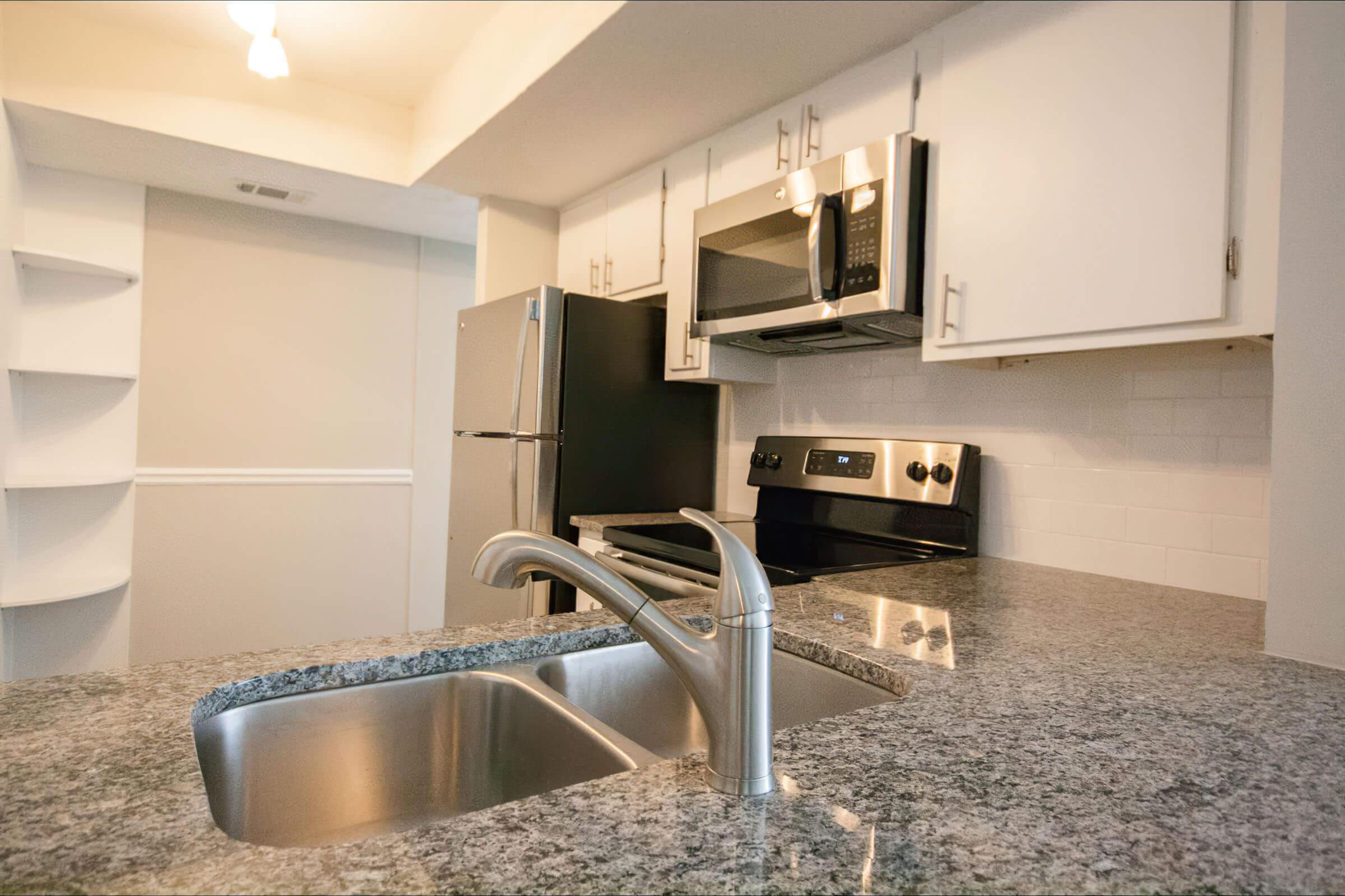 a kitchen with stainless steel appliances