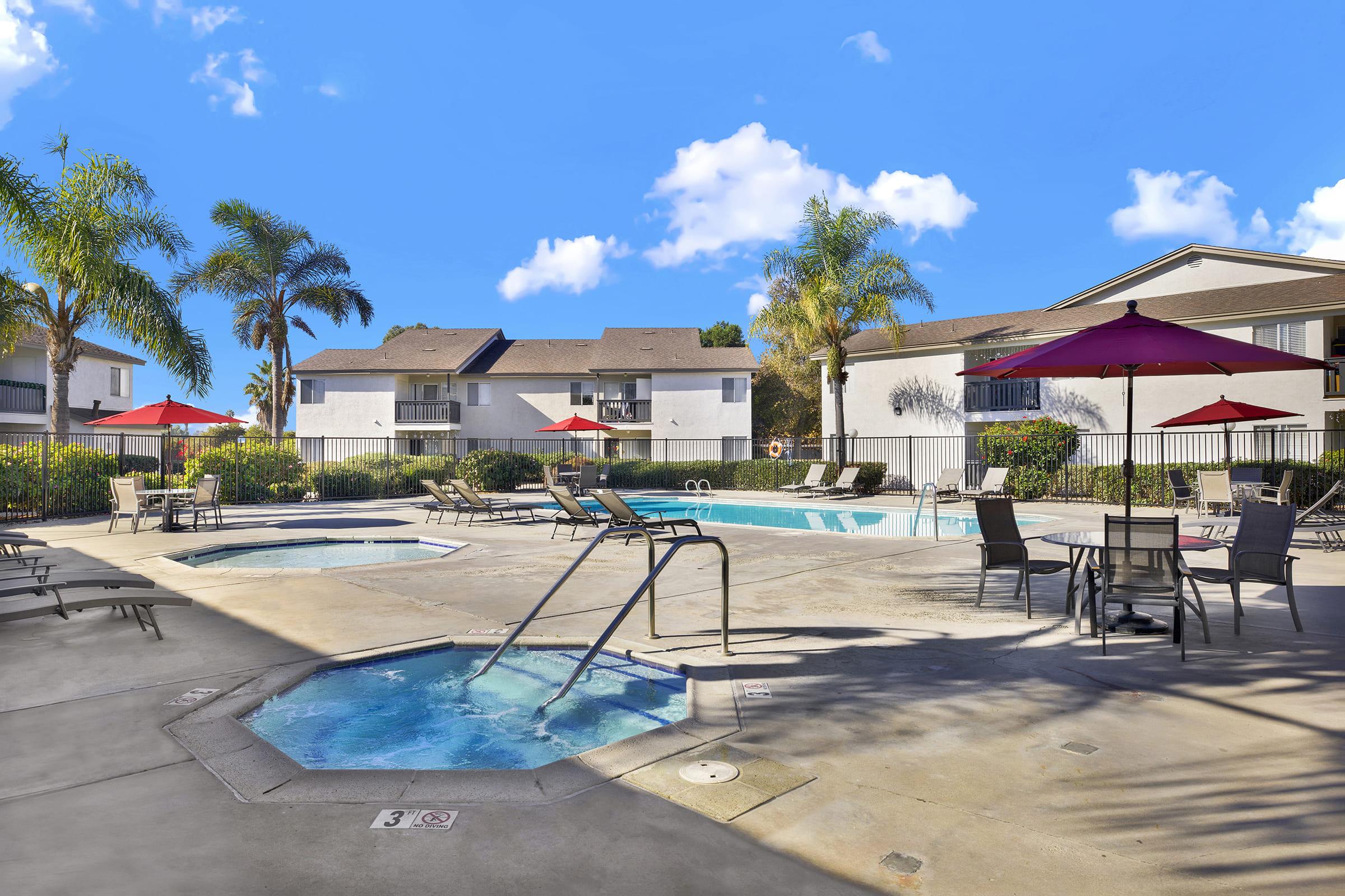 a house with a pool in front of a building