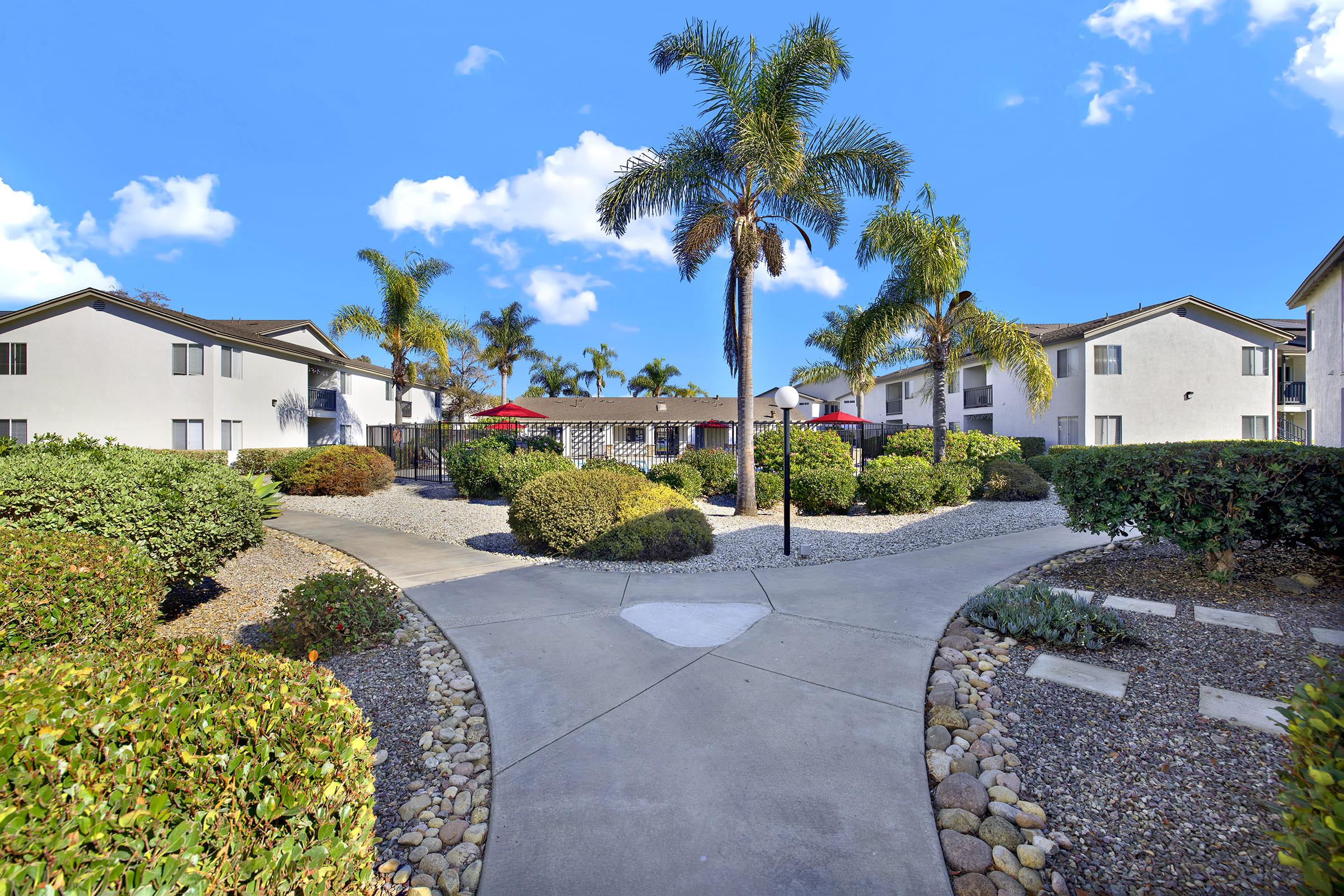 a house with bushes in front of a building