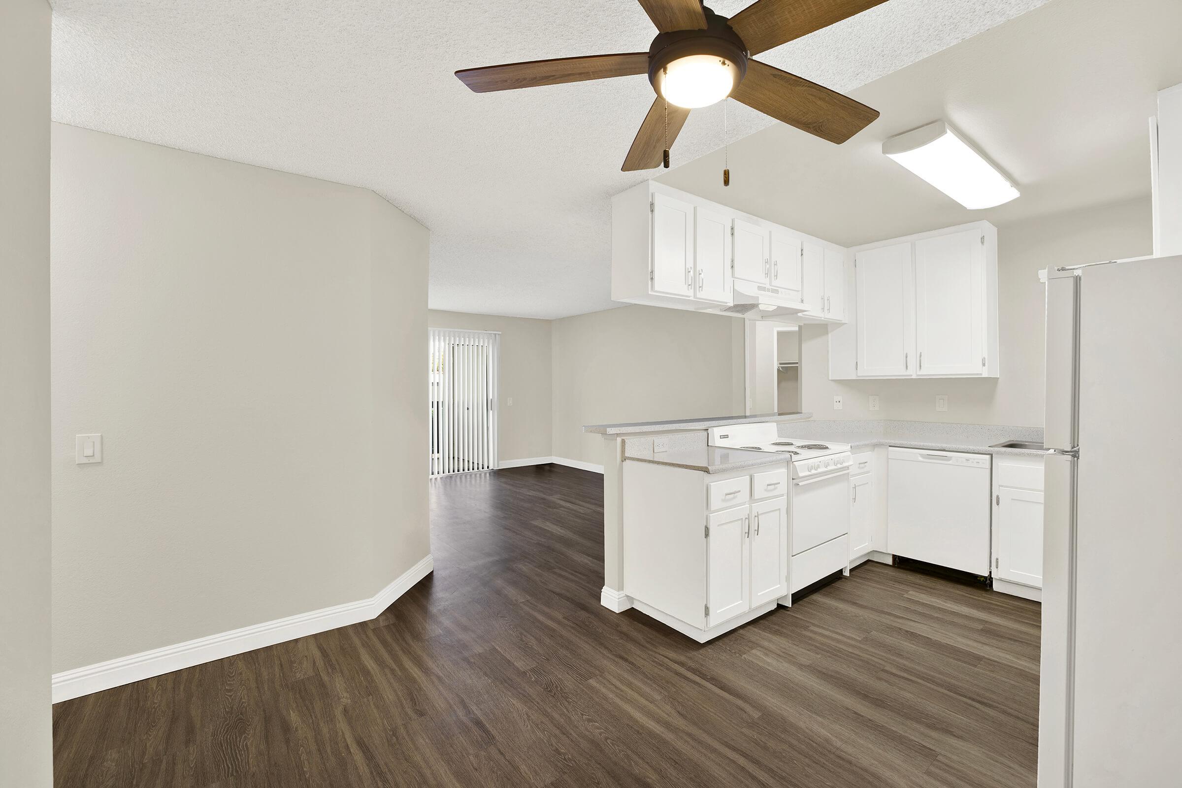 a kitchen with a stove and a refrigerator