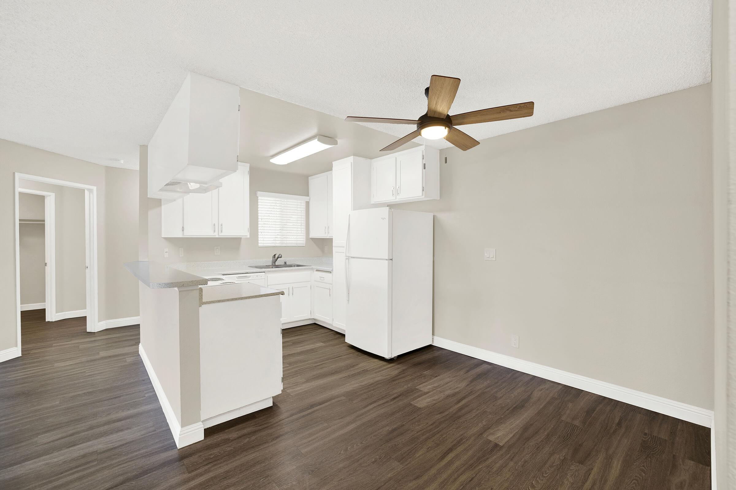 a kitchen with a wooden floor