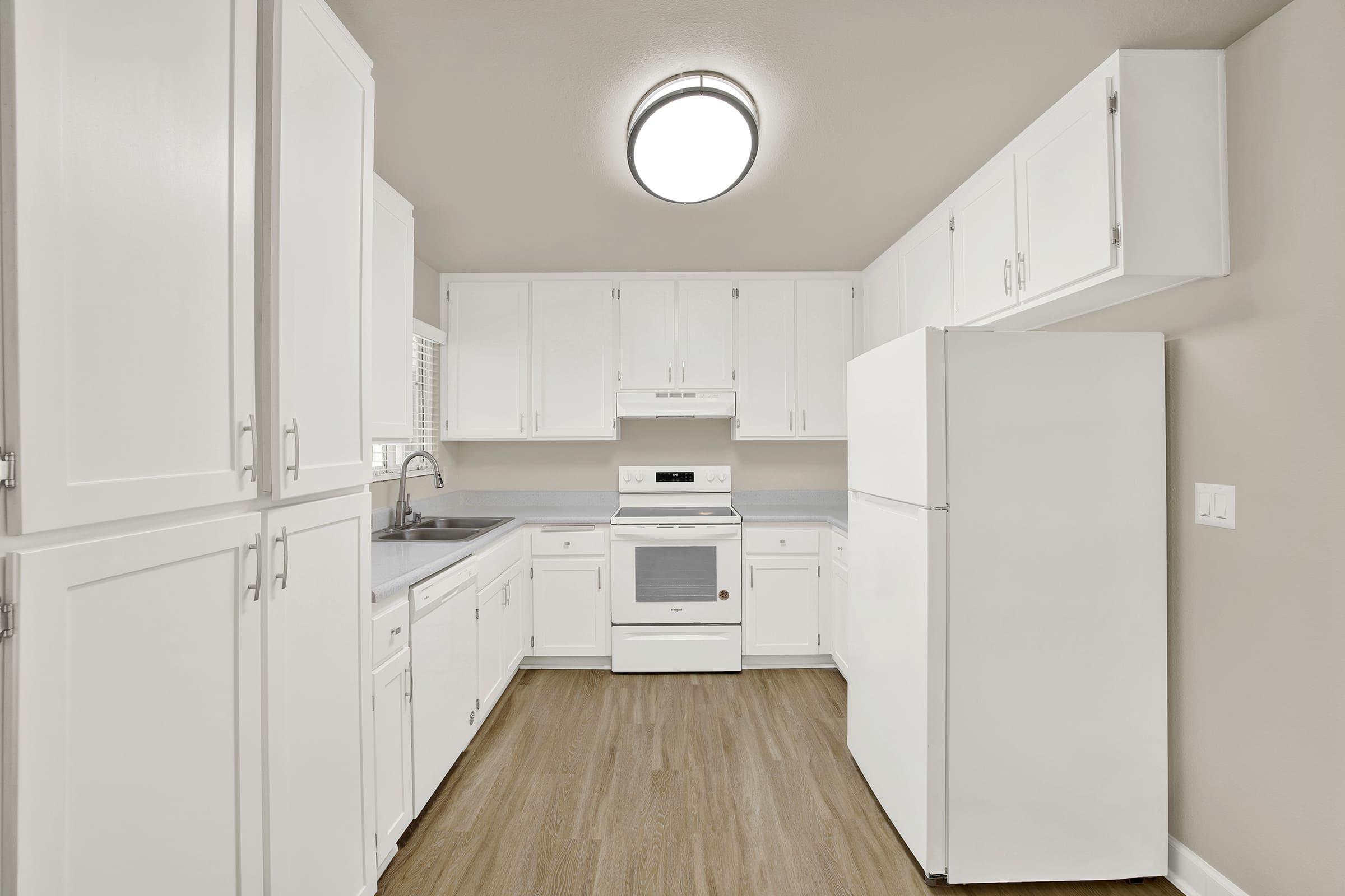 a kitchen with a stove and a refrigerator