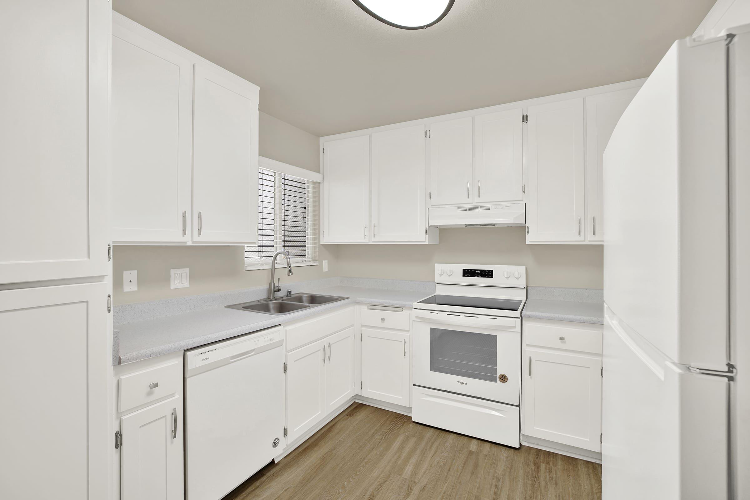 a kitchen with a stove top oven sitting inside of a refrigerator