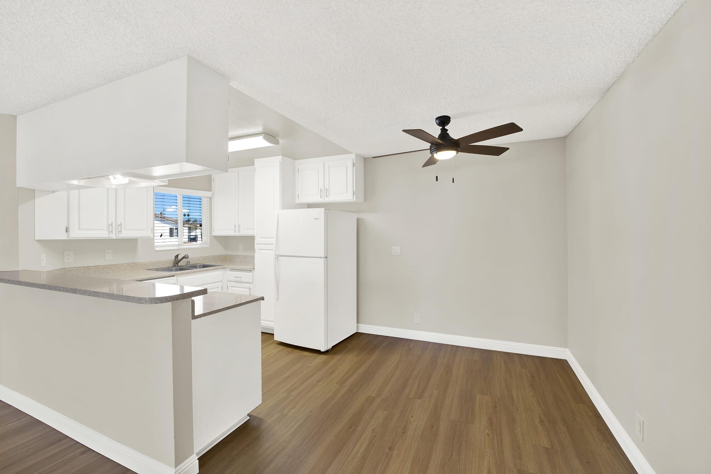 a kitchen with a stove and a refrigerator