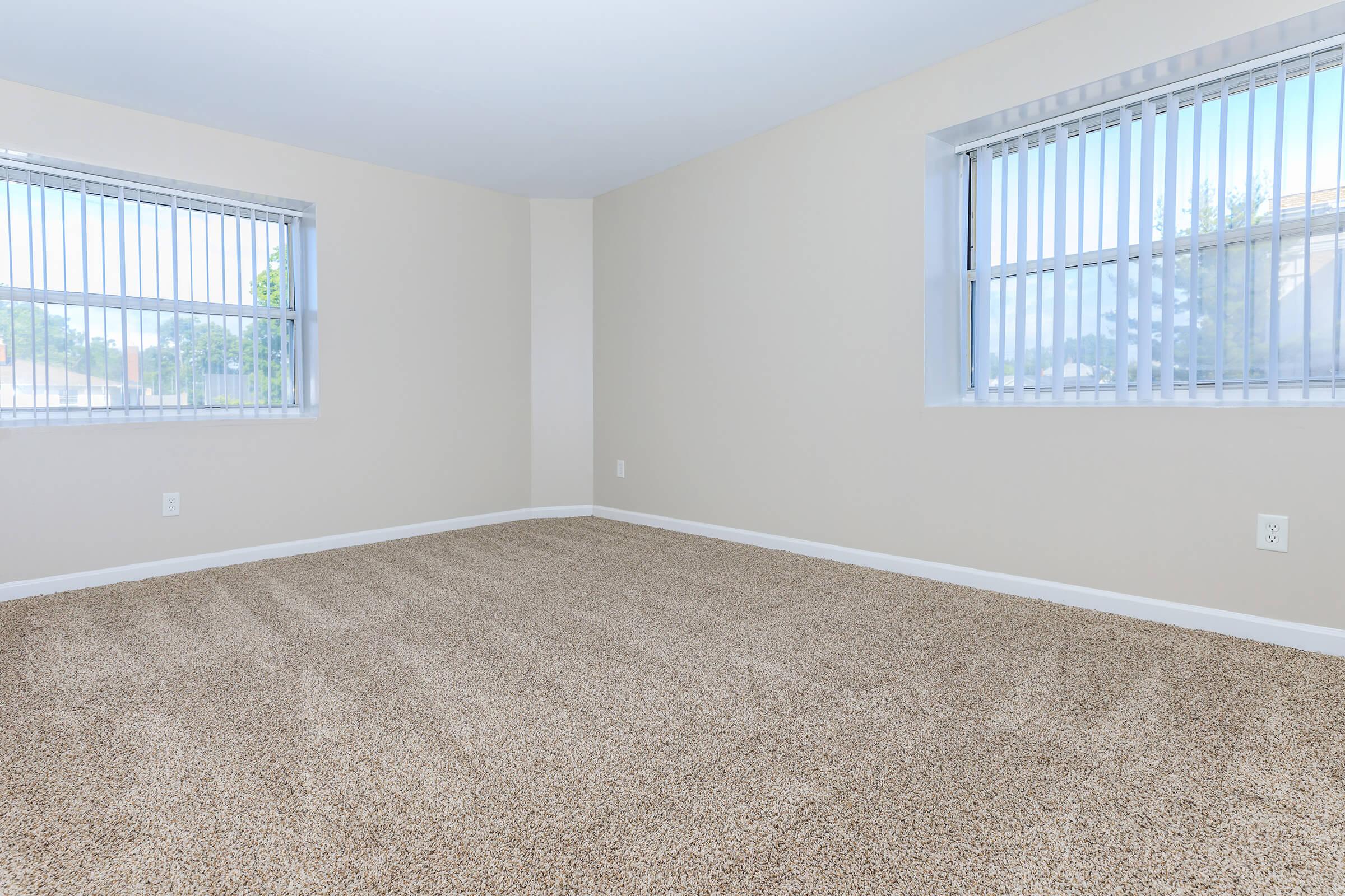 a bedroom with a large window