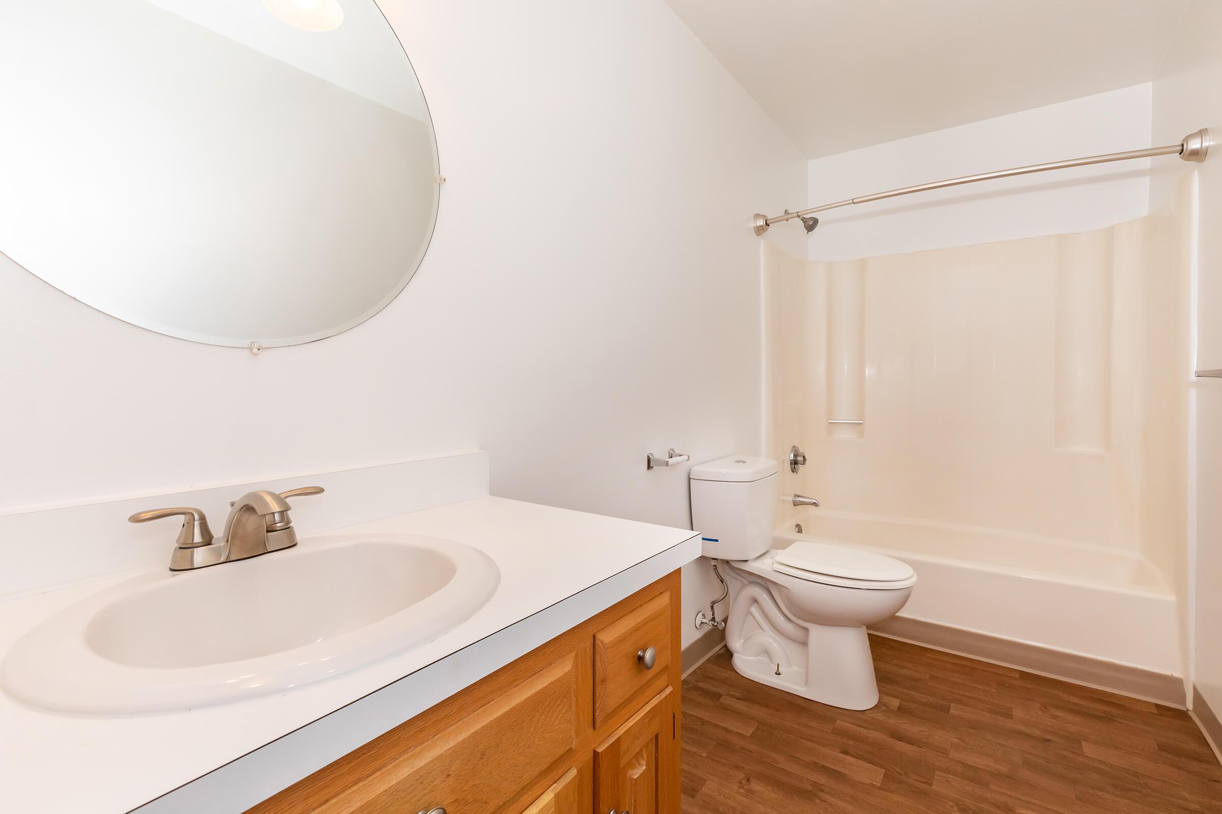 a large white tub sitting next to a sink