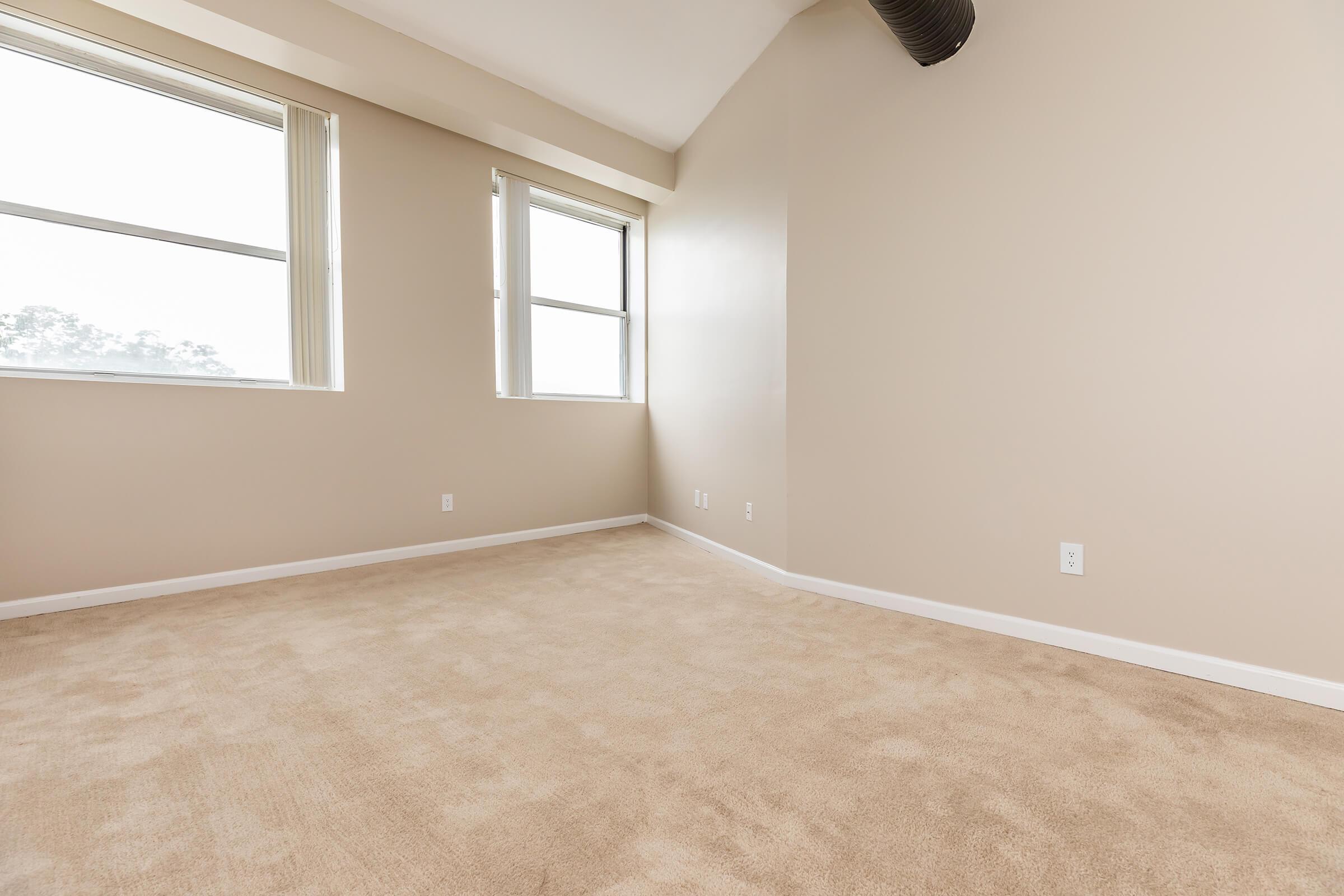 a bedroom with a large window