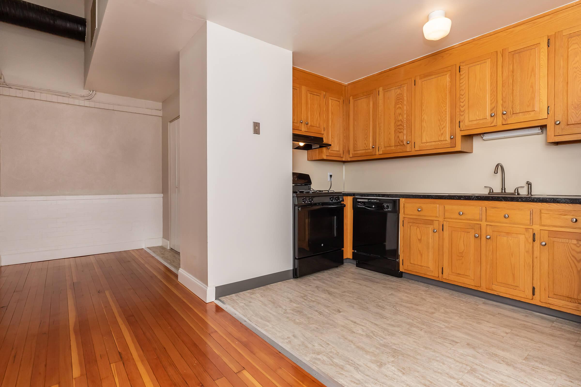 a kitchen with a wood floor