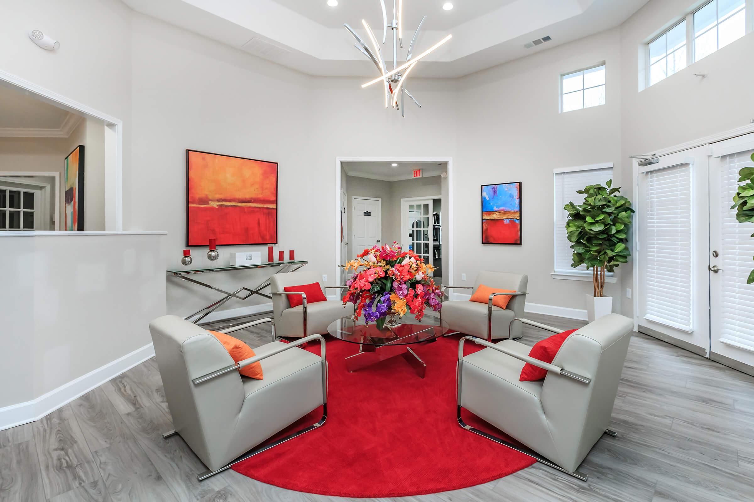 a living room filled with furniture and a flat screen tv