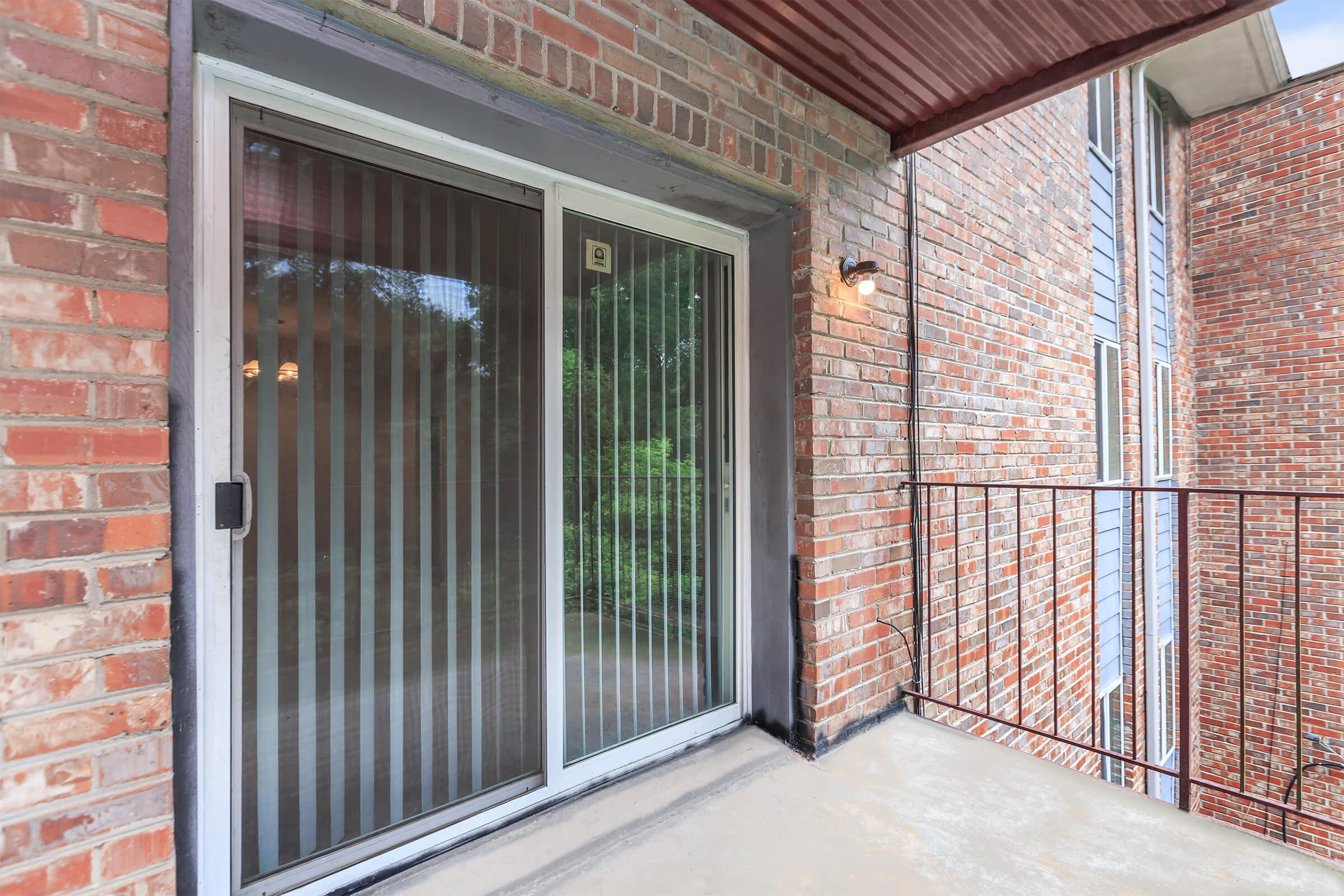 a door with a red brick building