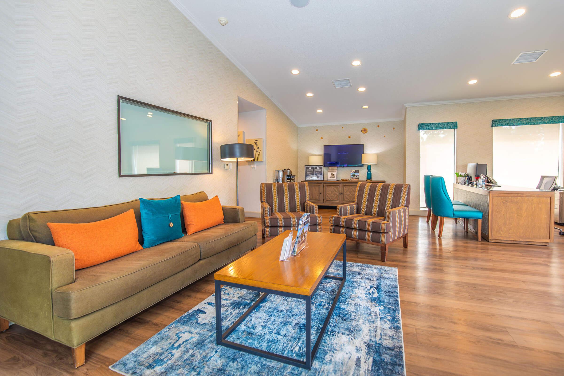 a living room filled with furniture and a table