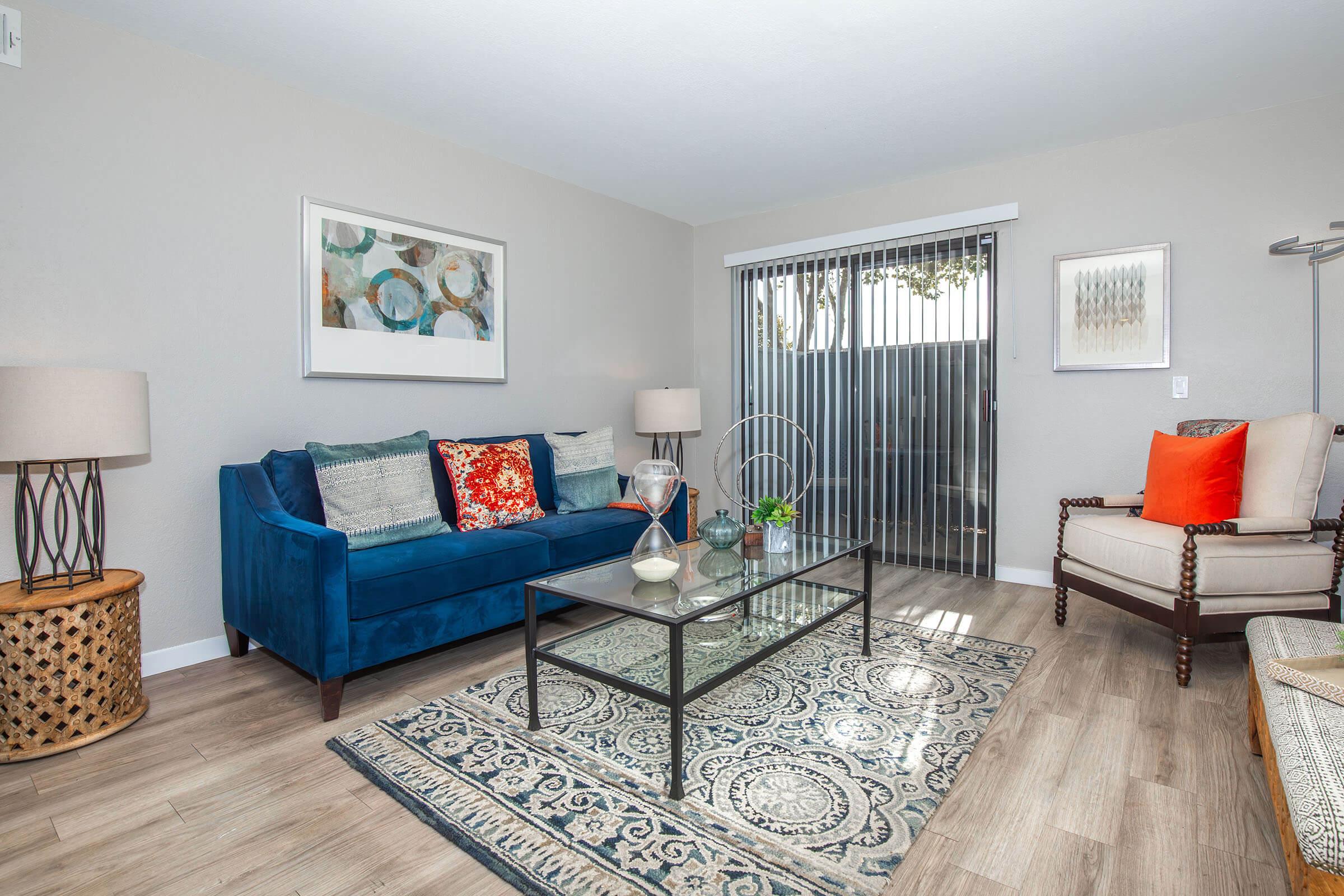 a living room filled with furniture and a rug