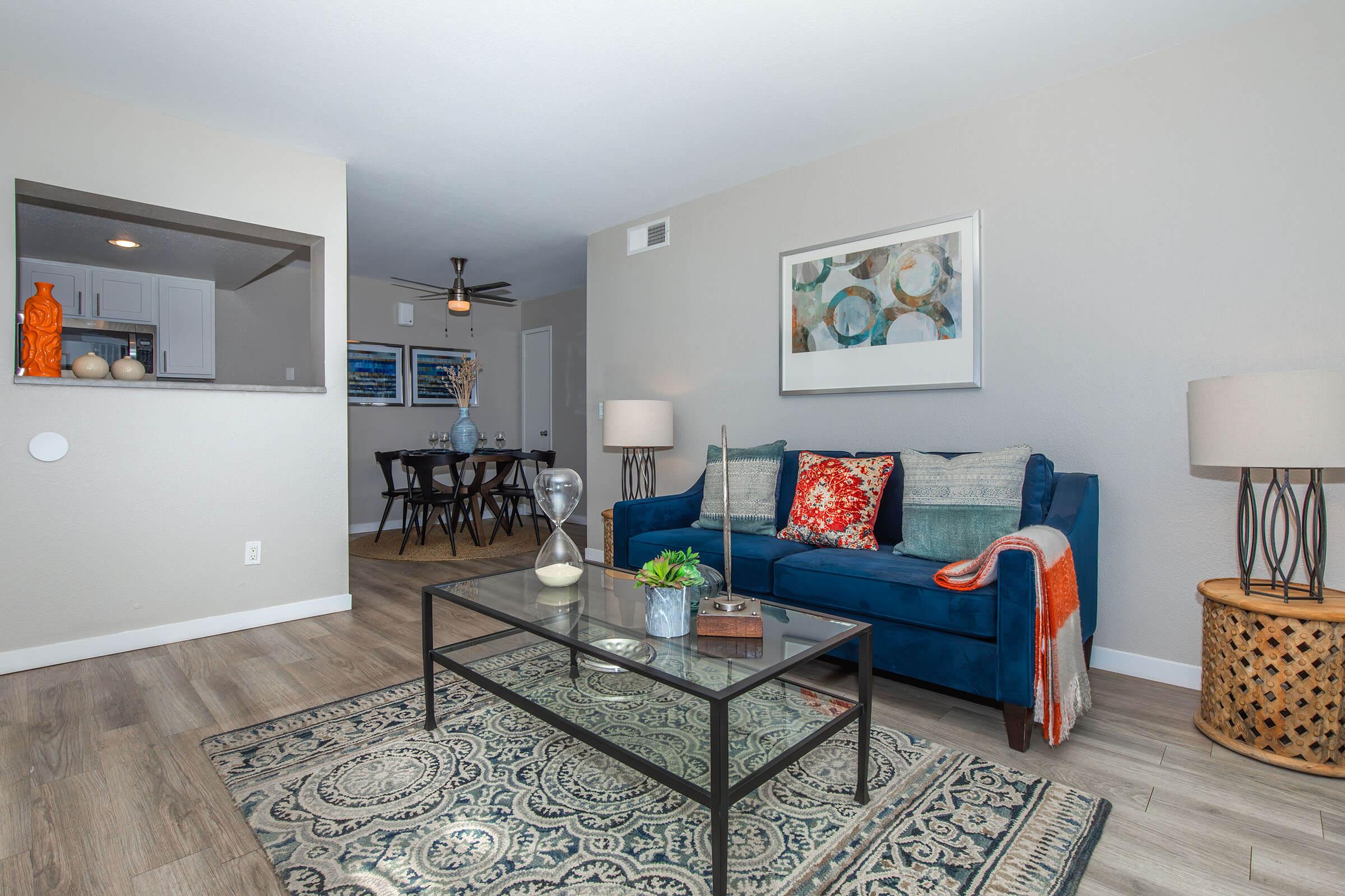 a living room filled with furniture and decor