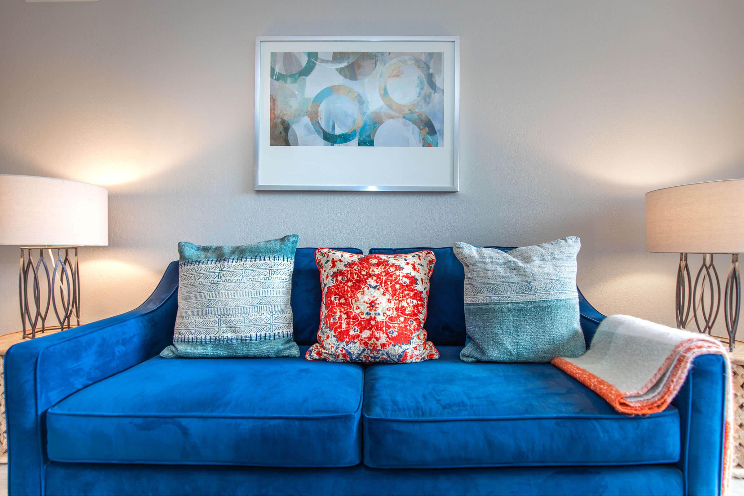 a living room with a blue blanket