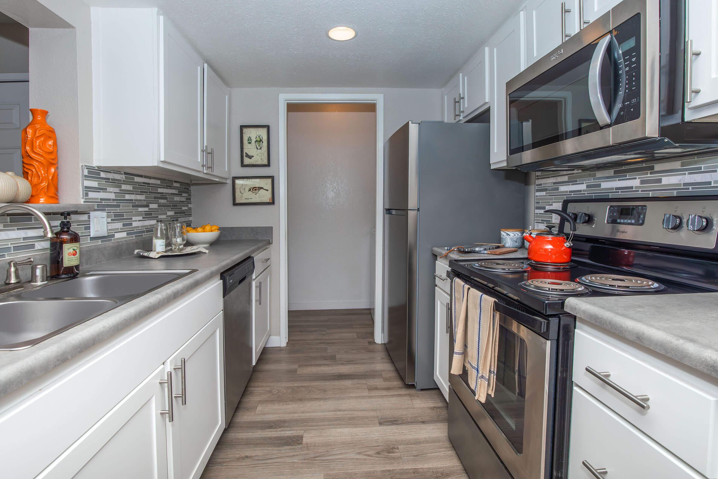 a modern kitchen with stainless steel appliances