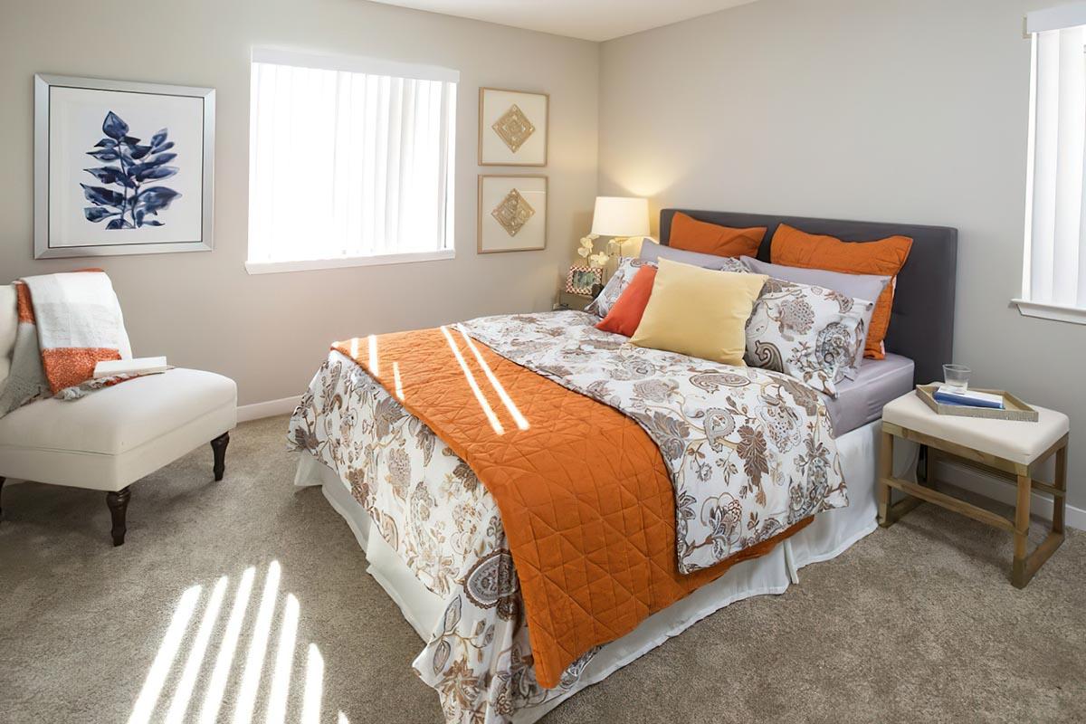 a living room filled with furniture and a bed