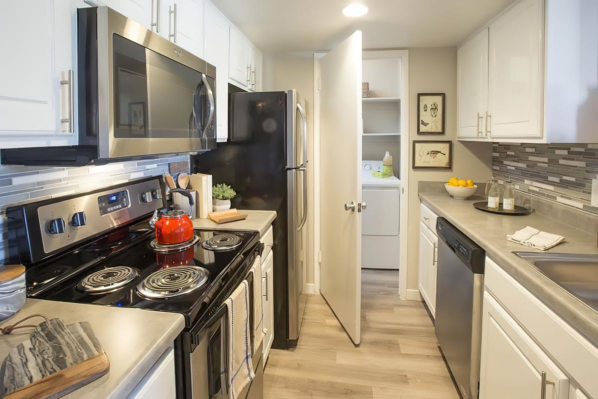 a modern kitchen with stainless steel appliances